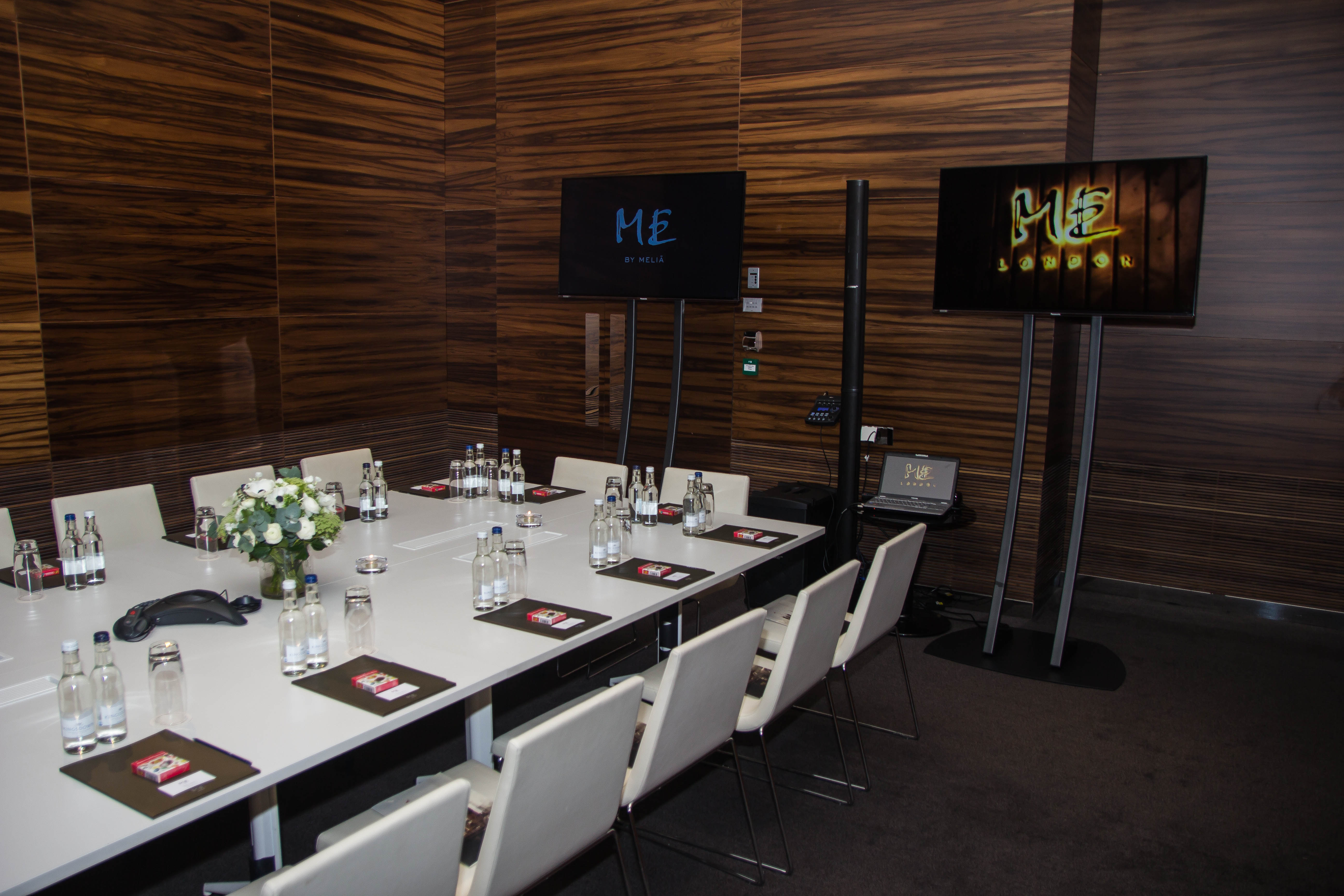 Modern meeting room in ME London Event Space with sleek table for professional gatherings.