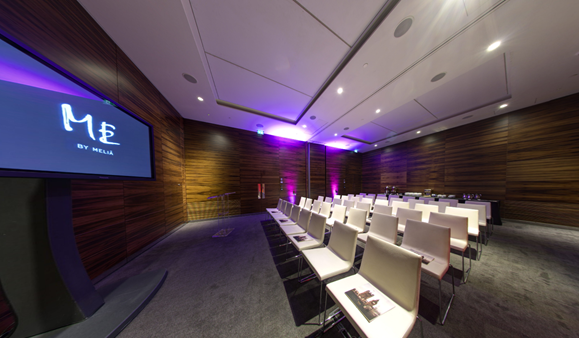 Modern meeting room with theater seating in ME London Event Space for corporate events.