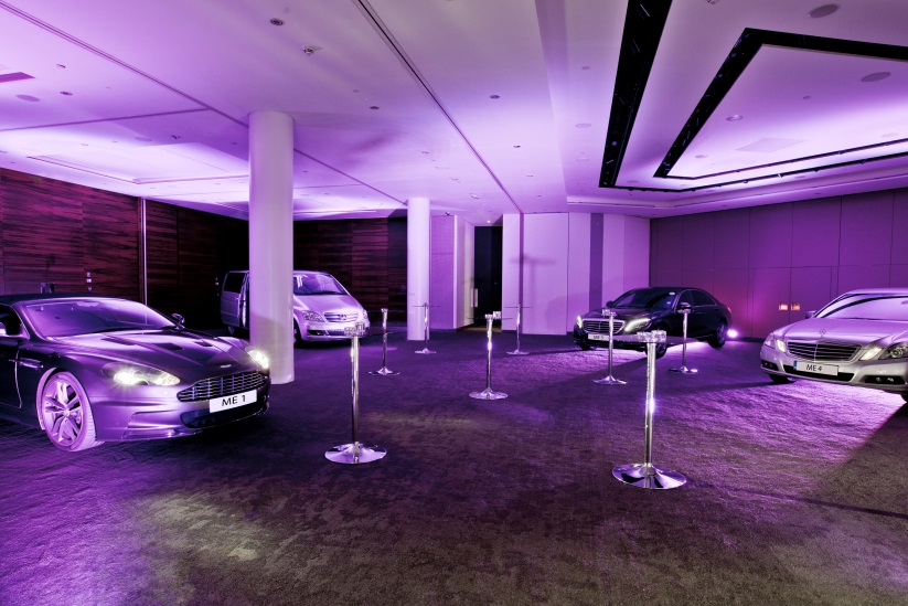 Luxury event space with modern design and ambient lighting for automotive showcases.