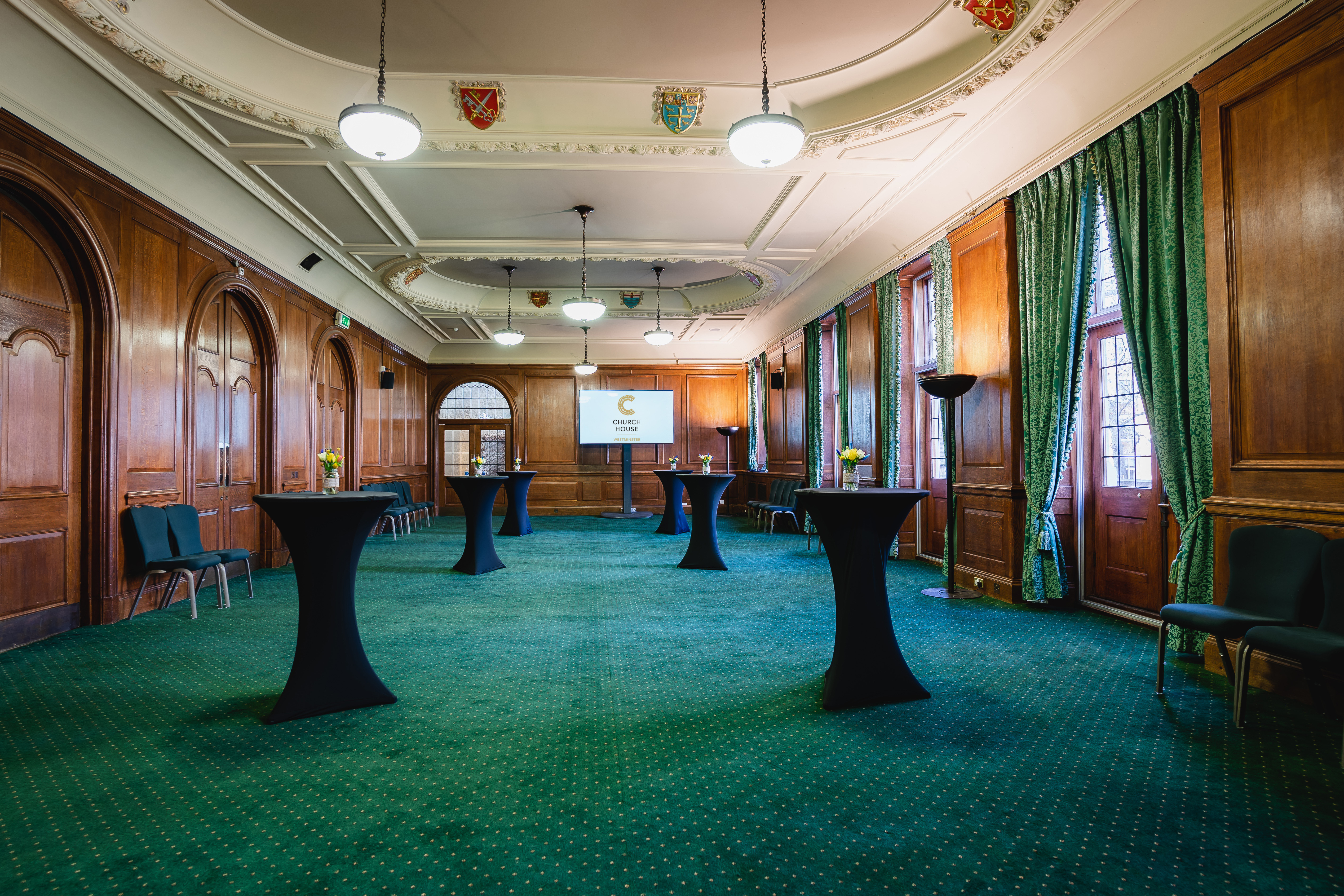 Bishop Partridge Hall: elegant event space with wooden paneling for receptions and networking.