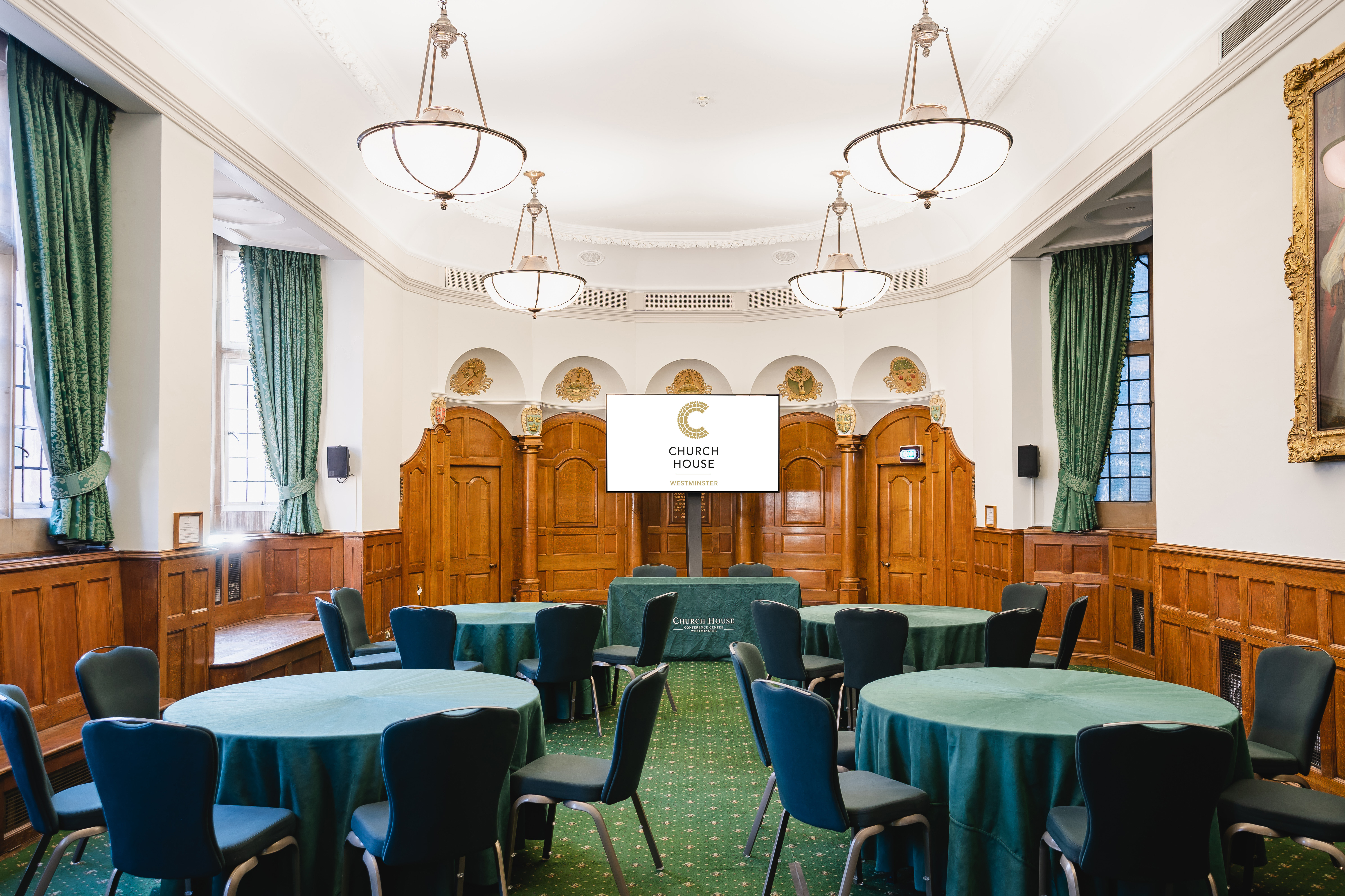 Convocation Hall in Church House Westminster, elegant wooden paneling, ideal for conferences.