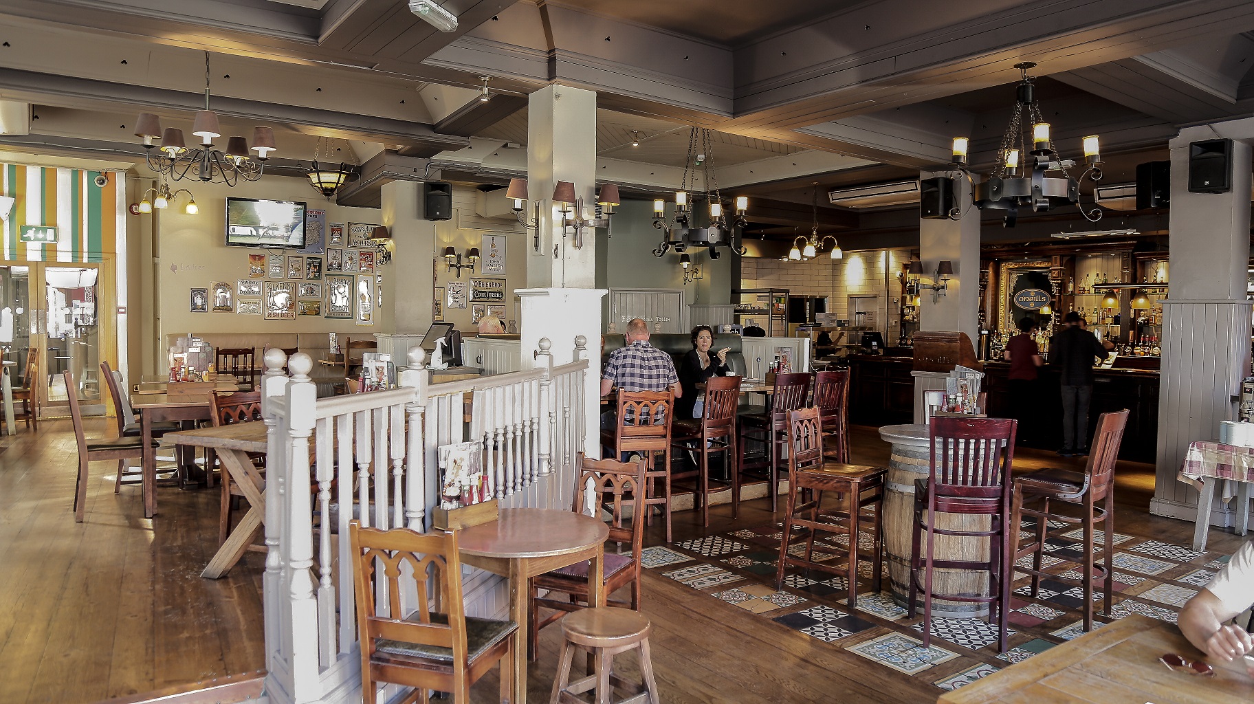 Spacious O'Neill's Kings Cross venue with rustic decor for casual meetings and events.