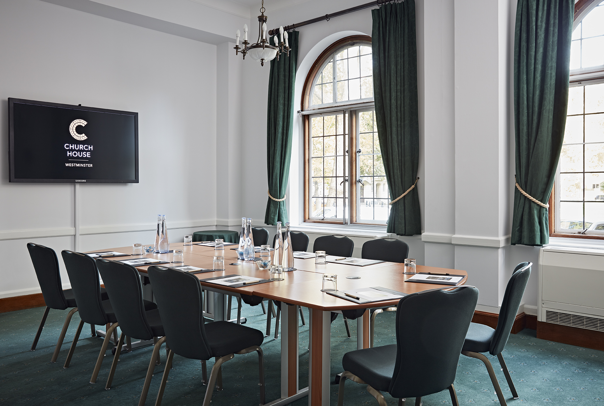 Sir Herbert Baker Room, Church House Westminster, modern meeting space with large screen.