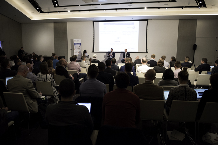 Panel discussion in modern ME Room, showcasing audience engagement and event planning.