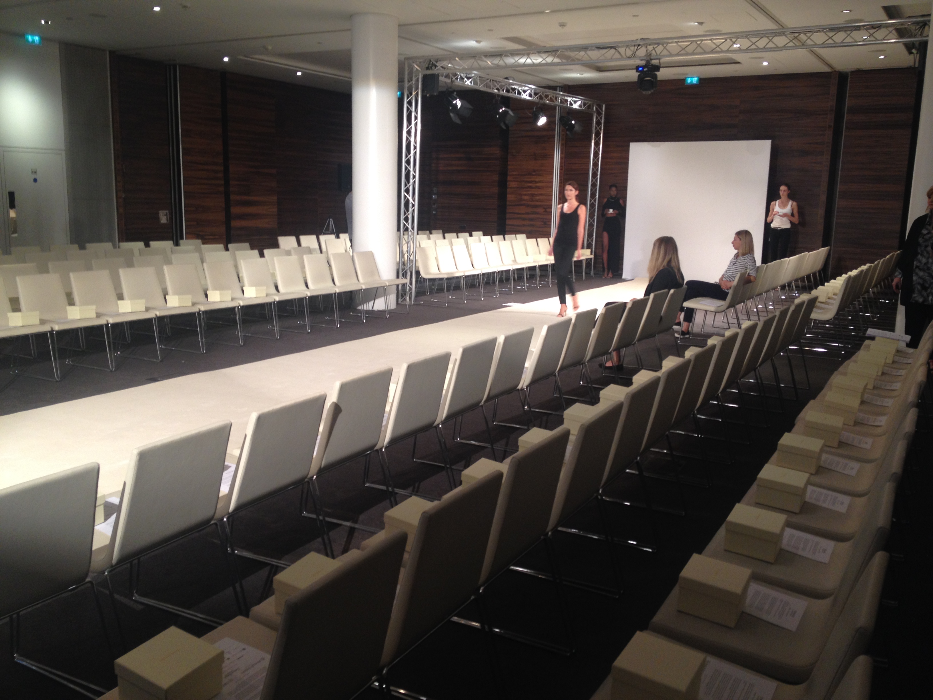 Modern ME Room event space set for a fashion show with defined runway and seating.