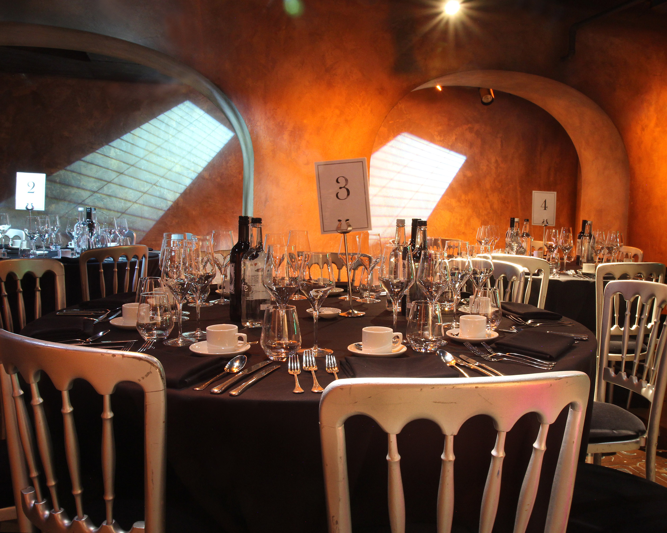 Elegant round table set for a formal dining event at Madame Tussauds.