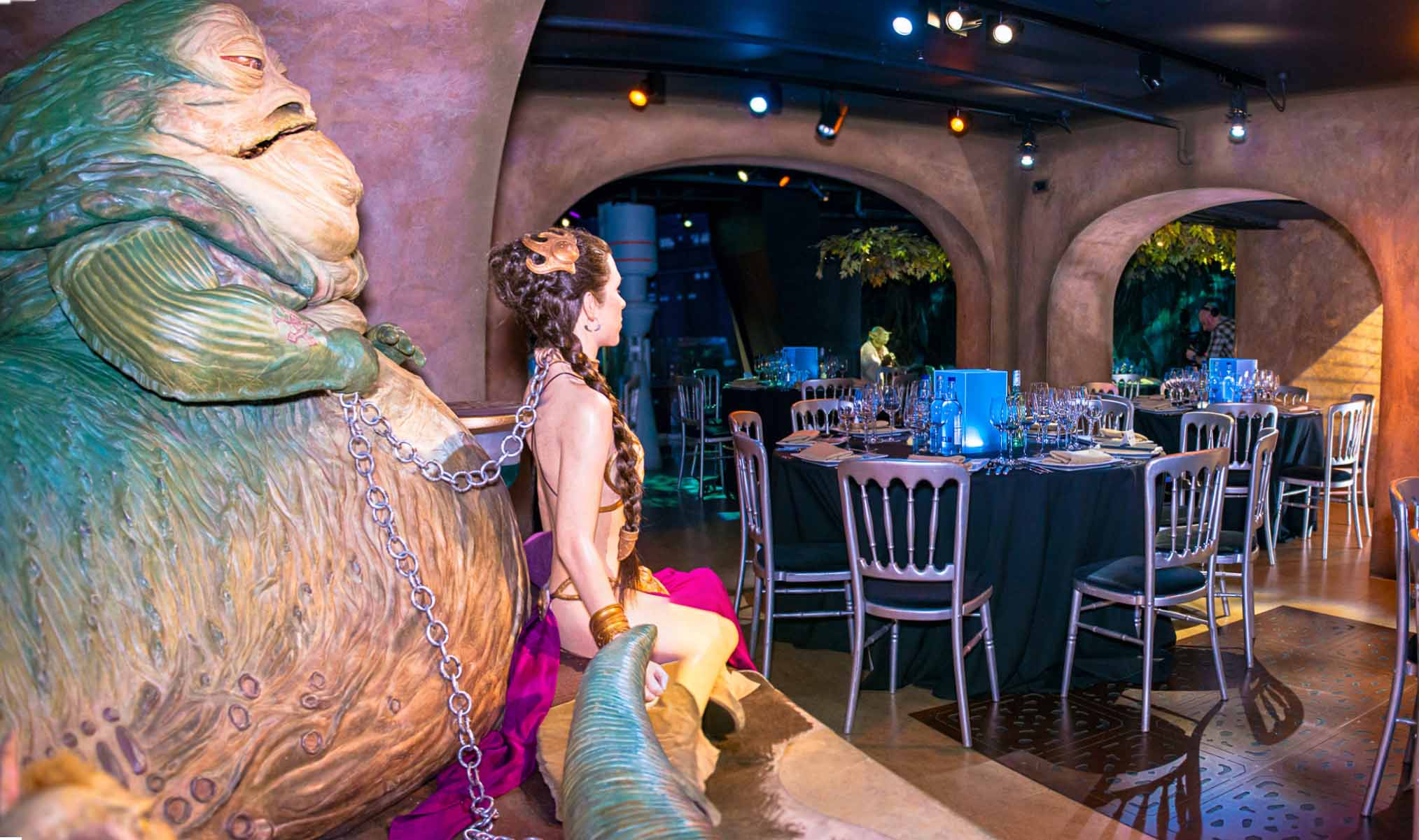 Movies at Madame Tussauds with classic cinema character and elegant dining setup.