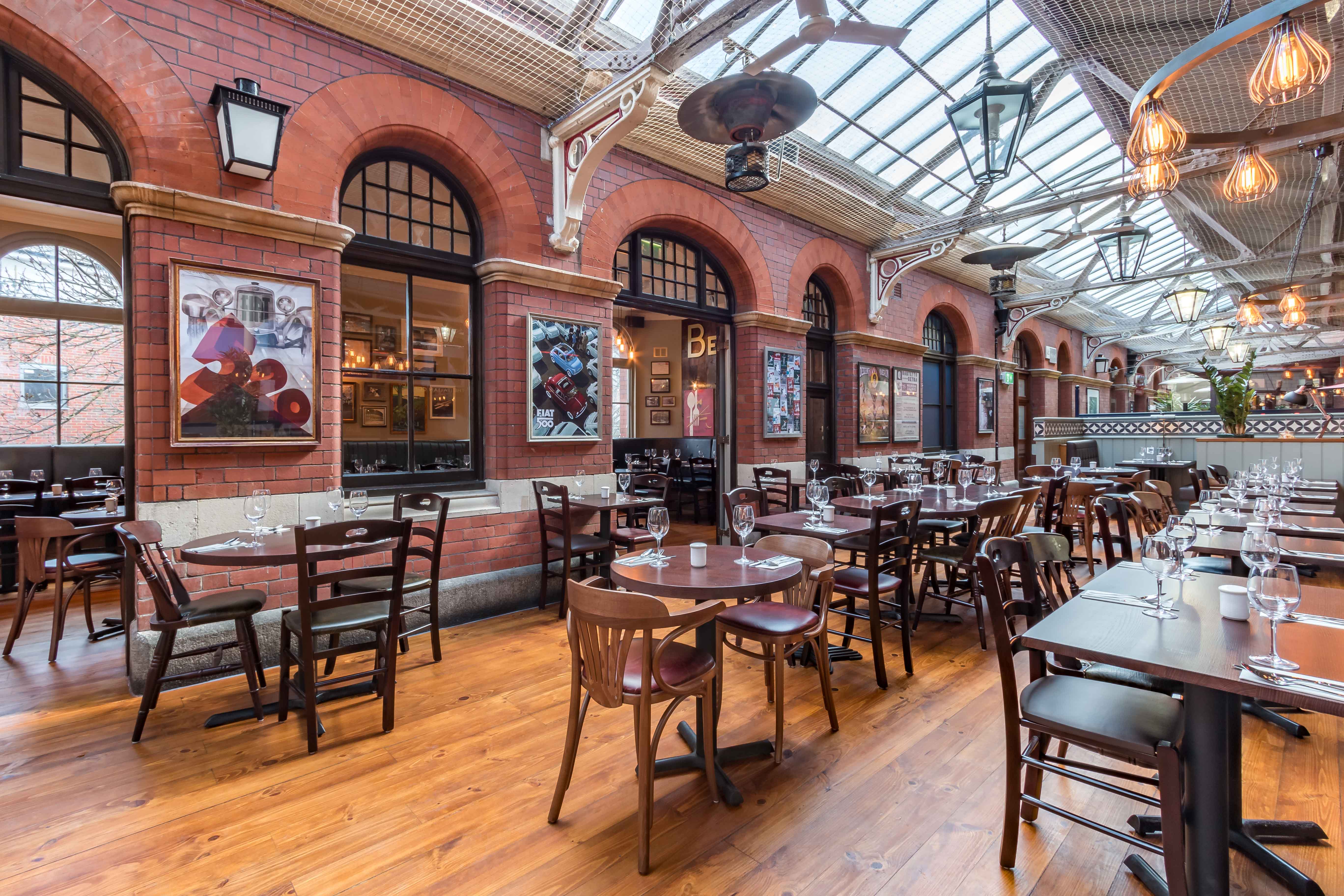 Siena Room at Bella Italia: spacious dining area with warm wood floors, ideal for events.