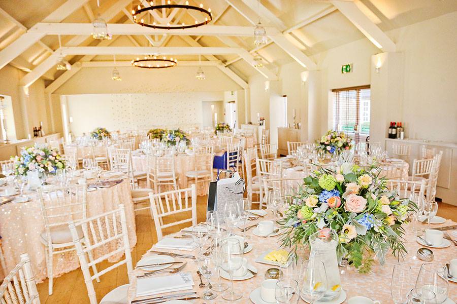 Elegant ballroom at Stoke Place with pastel floral decor, perfect for weddings and events.