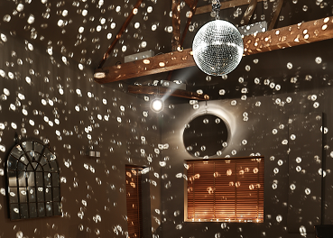 Ballroom at Stoke Place with disco ball, ideal for celebrations and gatherings.