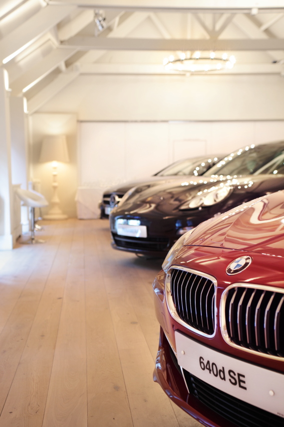 Luxury cars in elegant Stoke Place ballroom, ideal for high-end events and launches.
