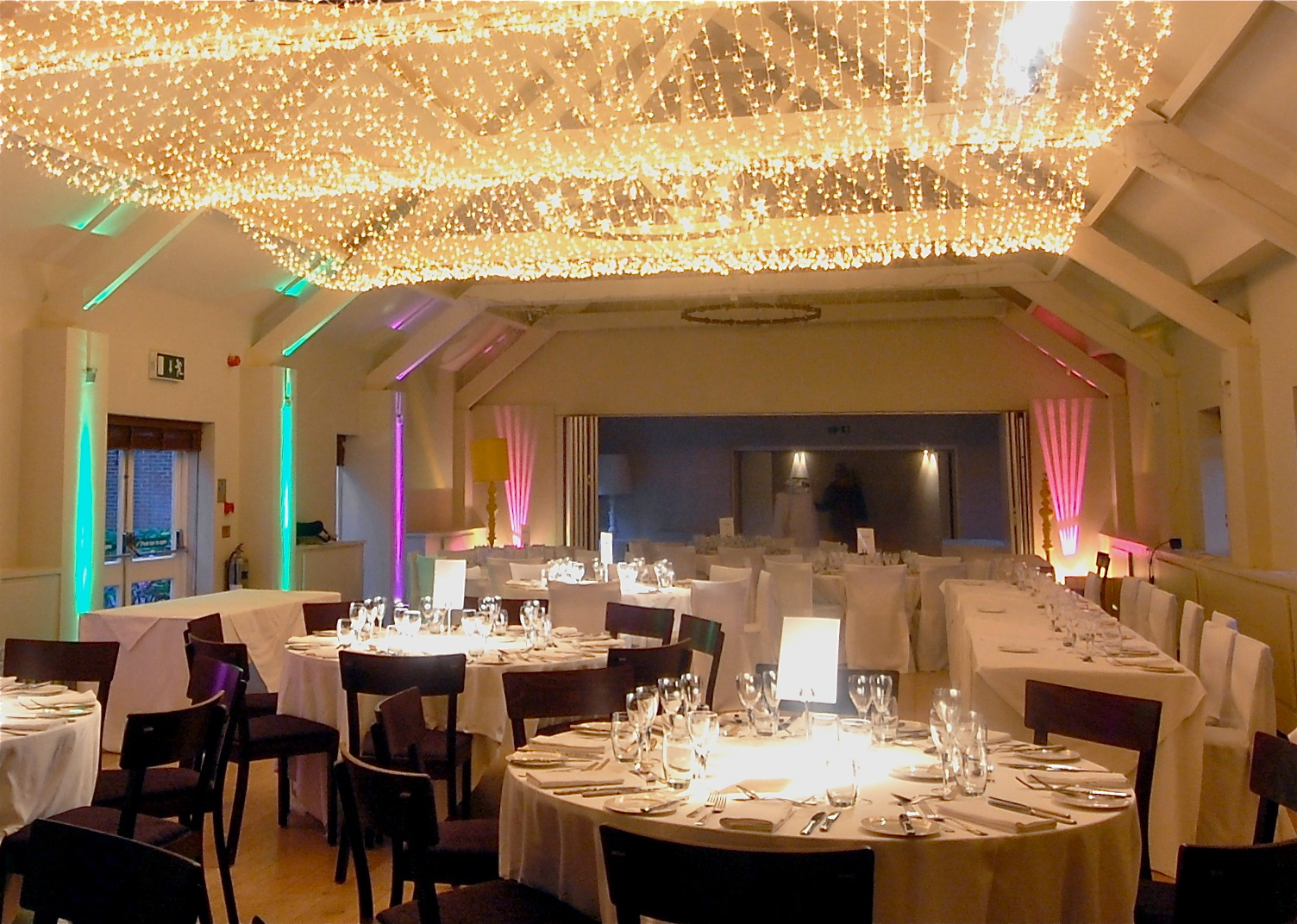 Elegant ballroom at Stoke Place with white linens, perfect for weddings and corporate events.