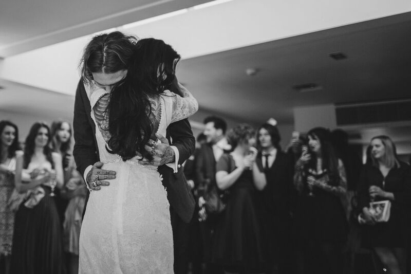 Couple's first dance at a wedding reception in Lakeside, Stoke Place, elegant ambiance.