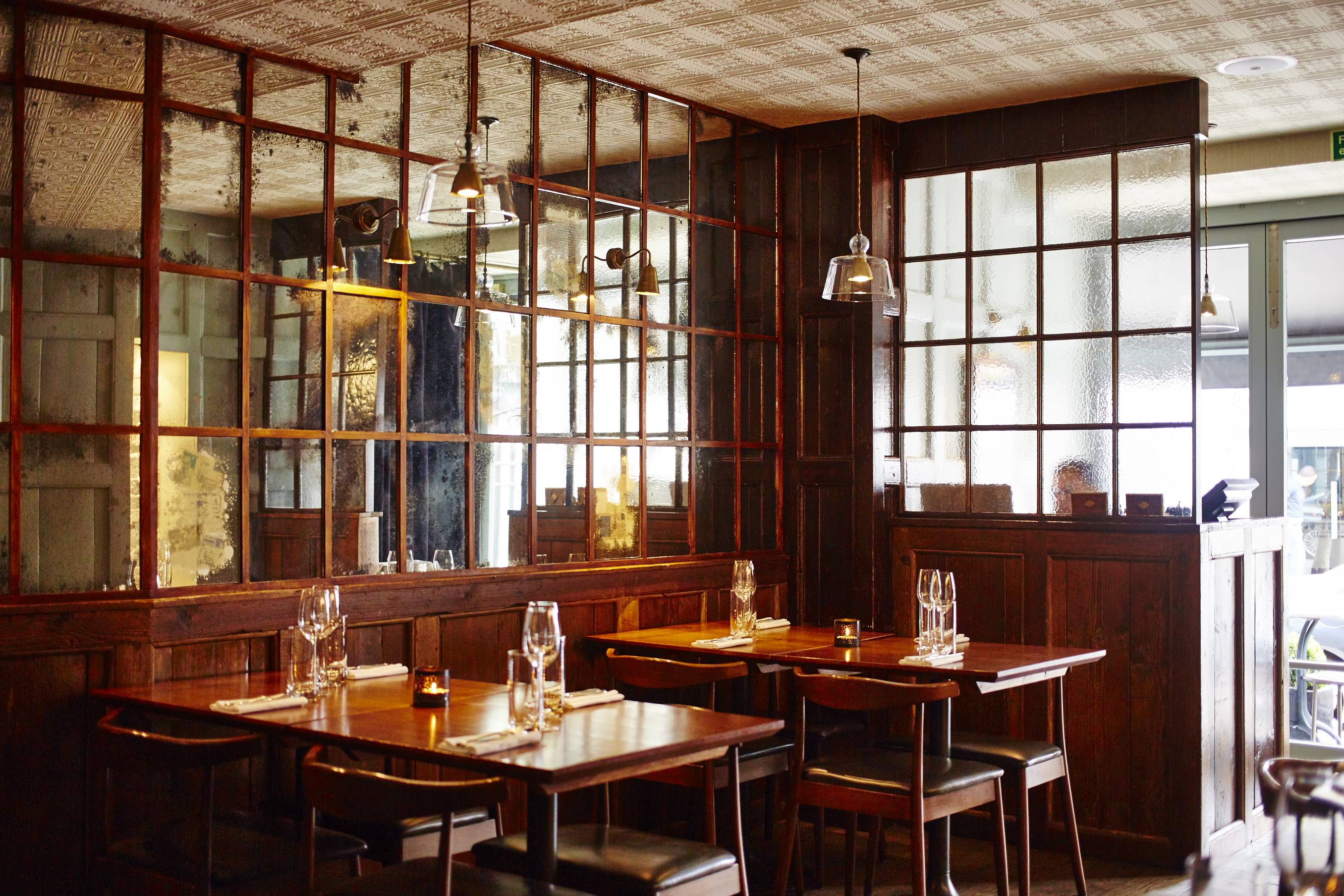 Stylish restaurant interior with warm wood accents, ideal for private events and gatherings.