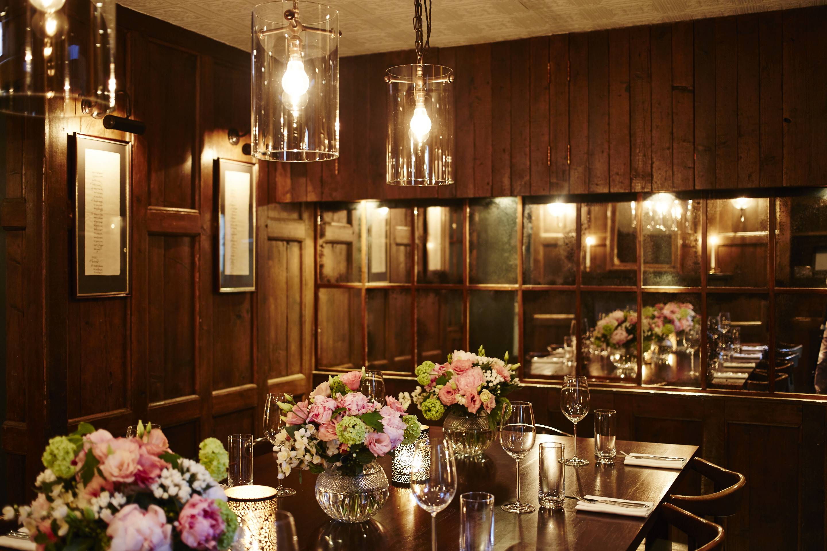 Elegant meeting space with floral centerpieces for corporate dinners and gatherings.