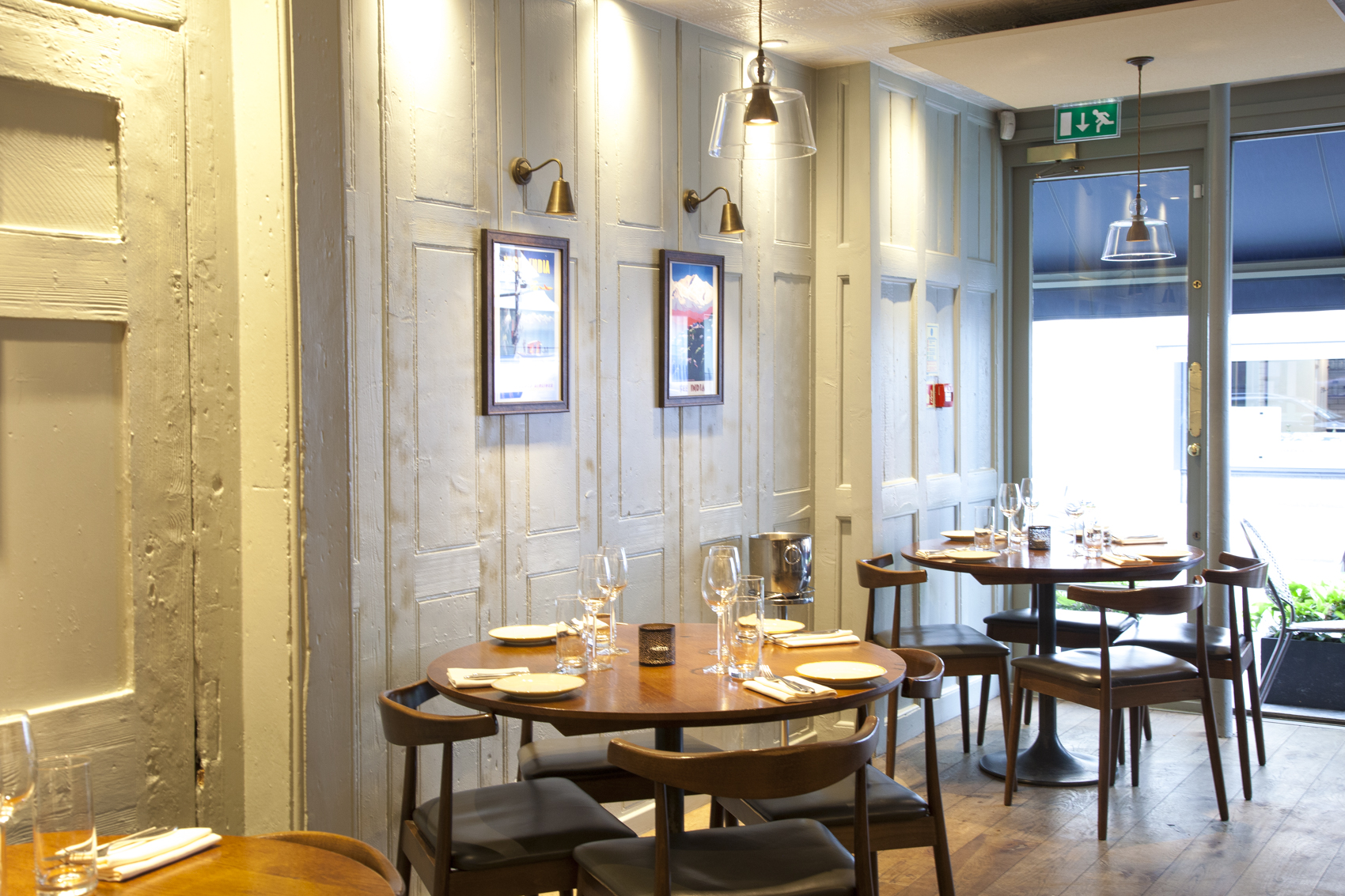 Stylish restaurant interior with warm lighting for intimate meetings and small events.