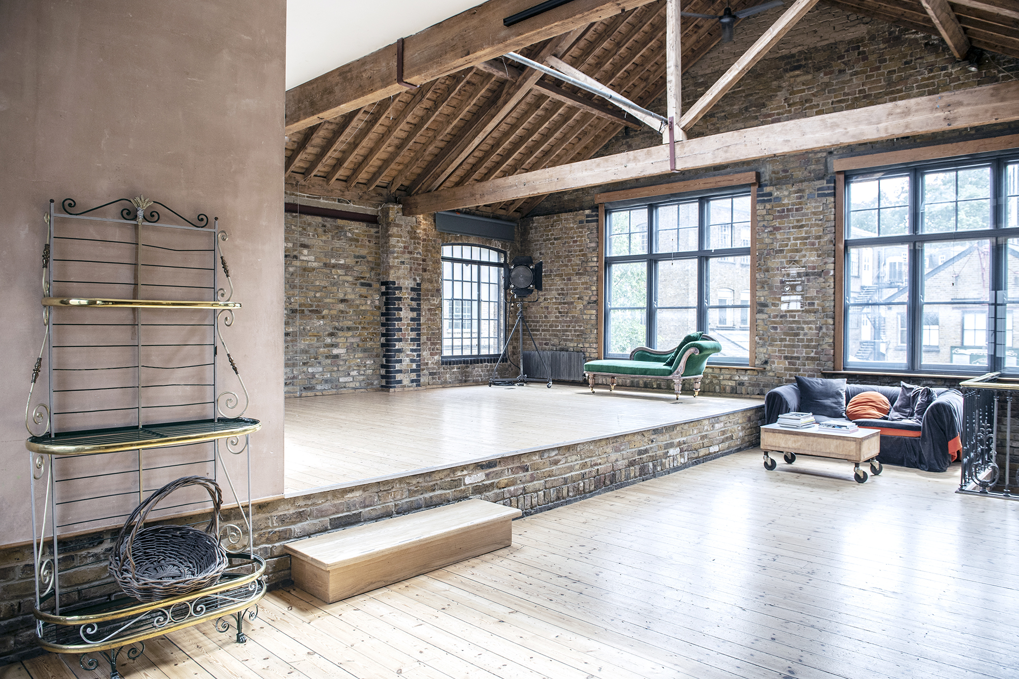 Spacious event venue with high ceilings, ideal for workshops and performances.