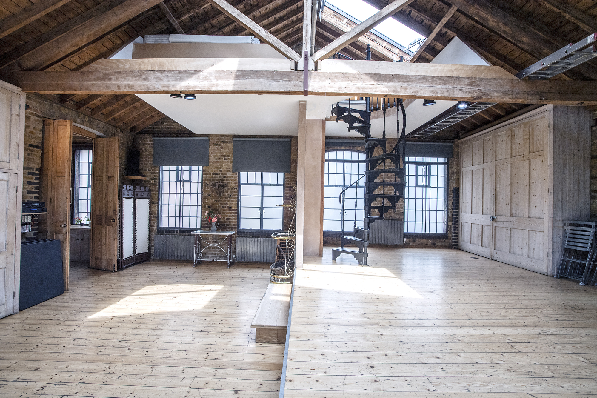 Spacious First Option Location Studio with rustic beams, ideal for workshops and events.