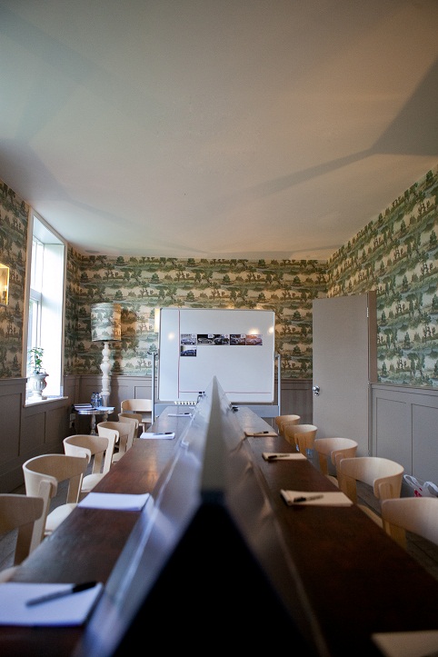 Fly Fishing Room at Stoke Place: modern meeting space with long table for workshops.