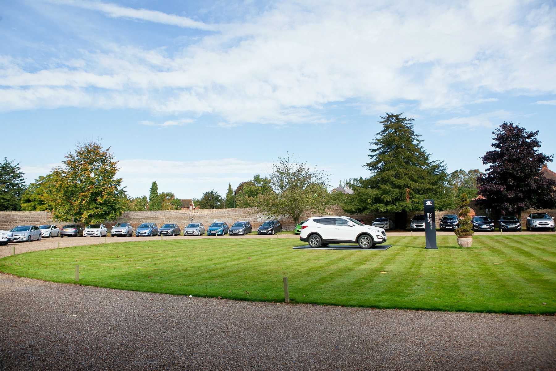 Exclusive outdoor venue at Stoke Place with manicured lawn for events and receptions.