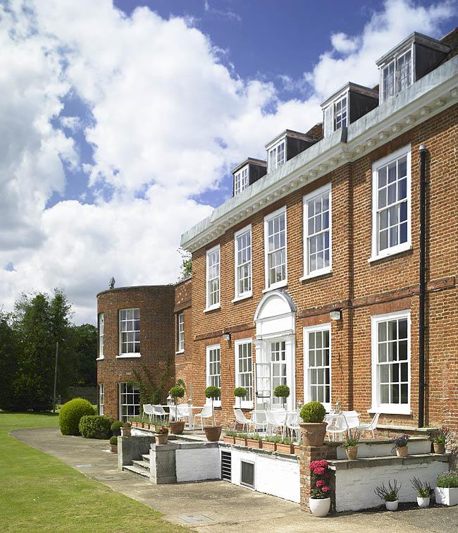 Charming brick venue at Stoke Place for corporate retreats and intimate events.