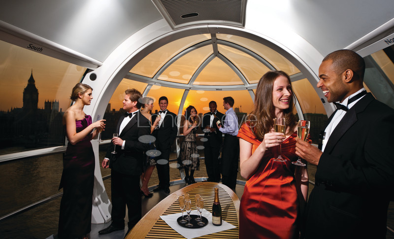 Elegant evening event in London Eye capsule with sunset views, perfect for networking.