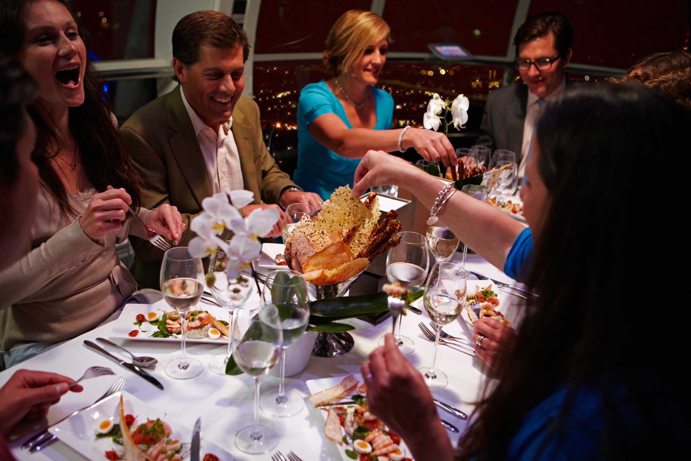 Private Capsule dinner event in The London Eye with elegant table setting and networking.