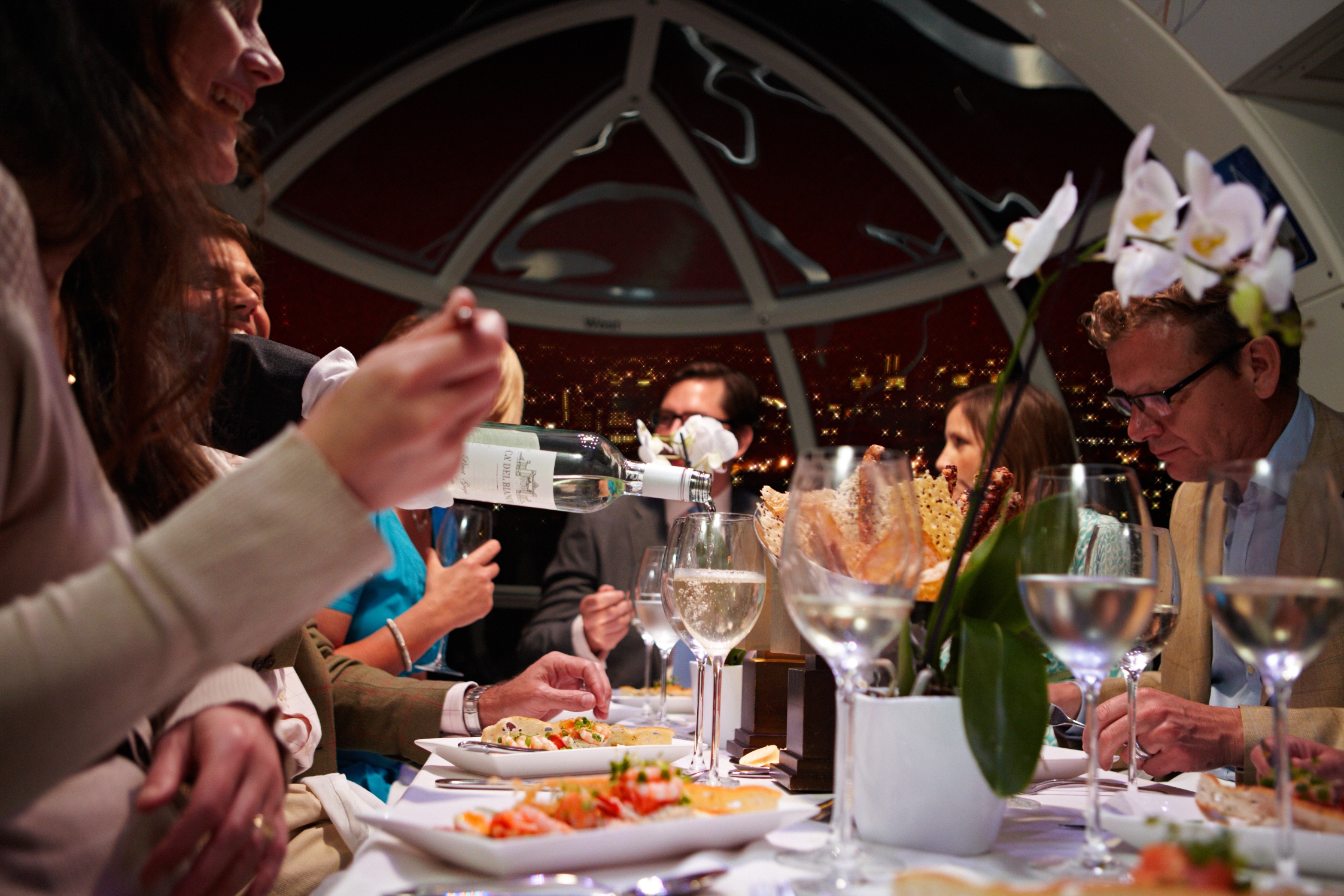 Private dining in The London Eye with skyline views for corporate events.