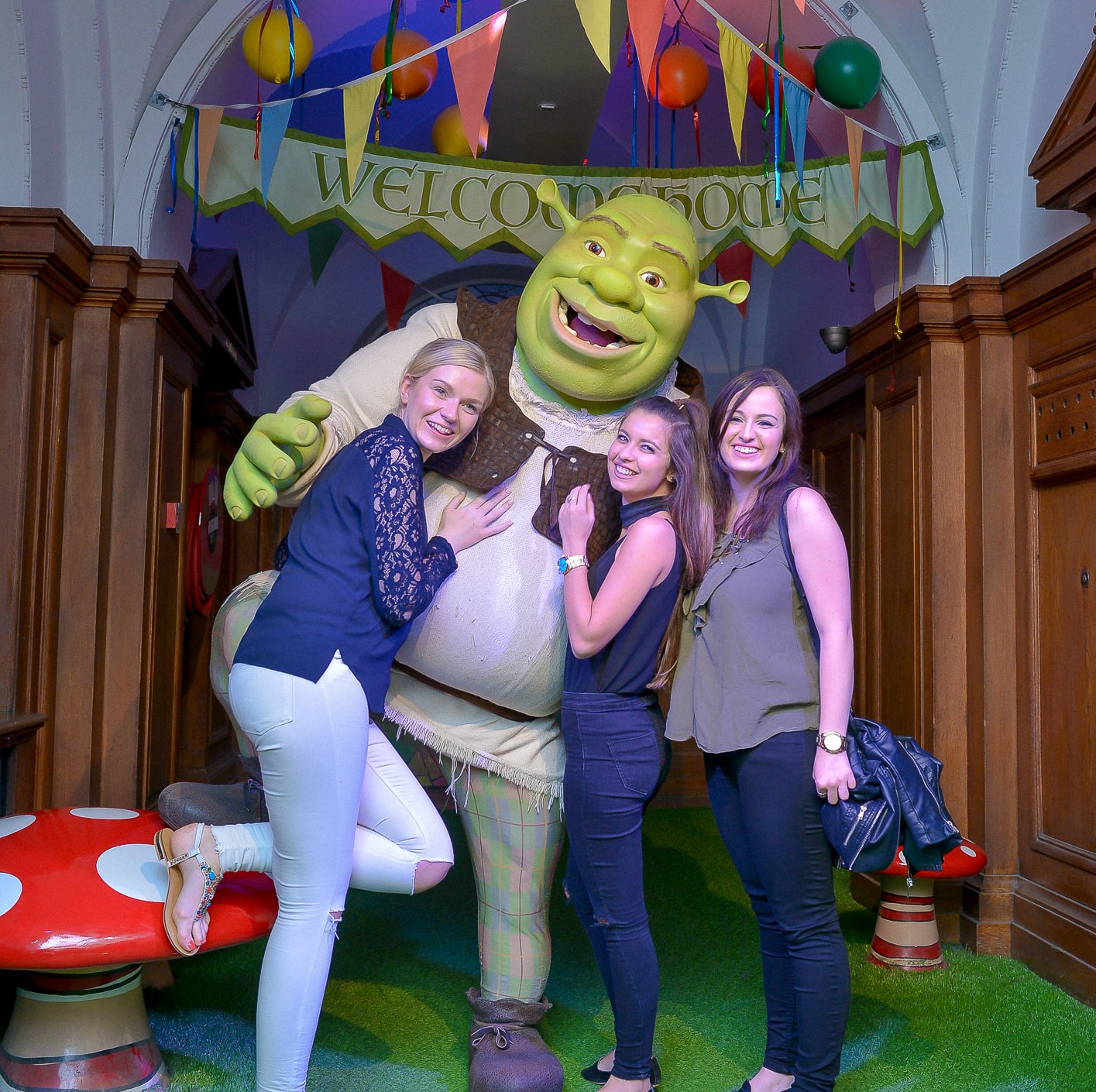 Vibrant event venue at Shrek's Adventure! London with colorful ogre decorations.
