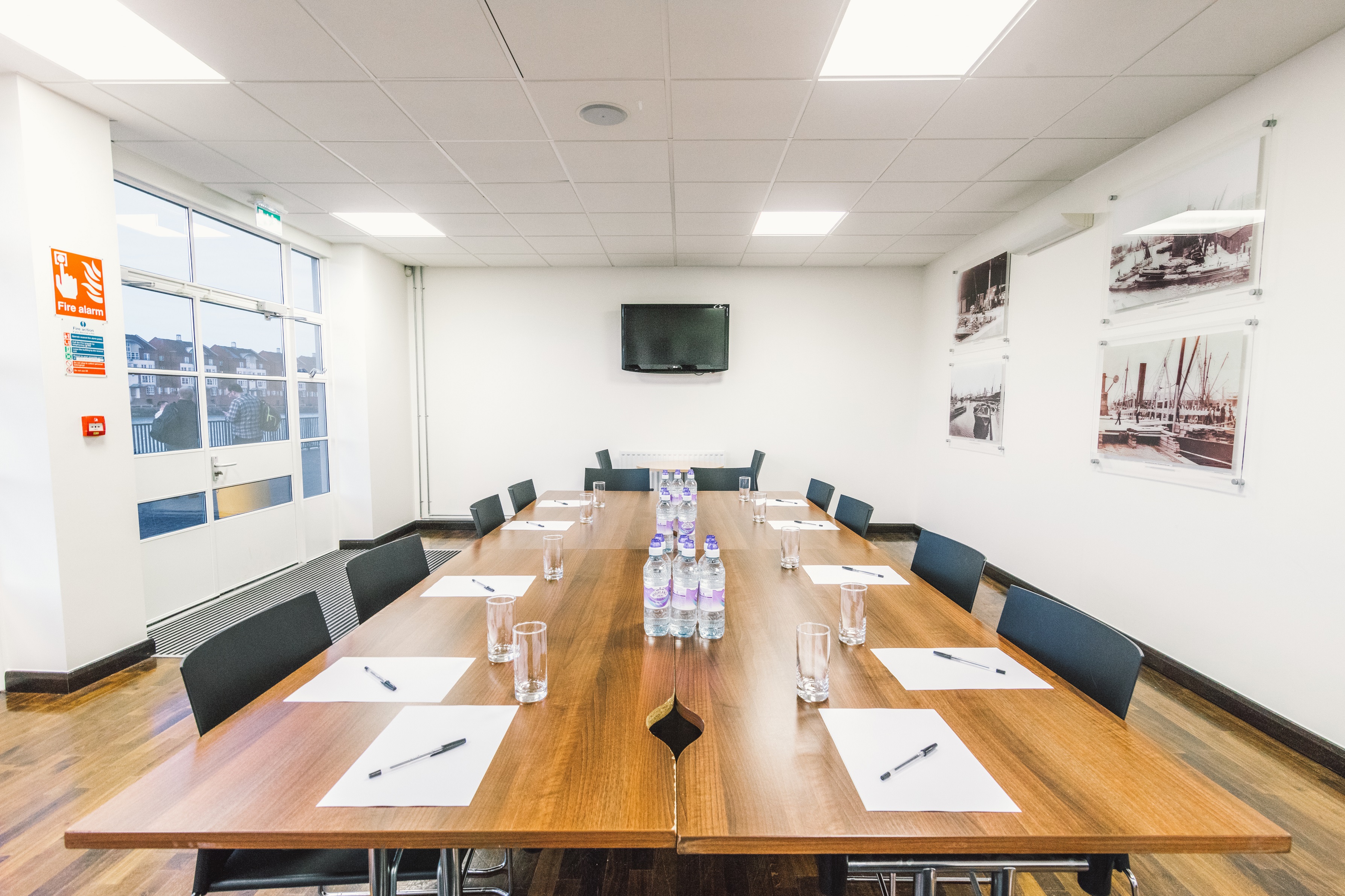 Surrey Docks meeting room with wooden table, ideal for professional events and presentations.