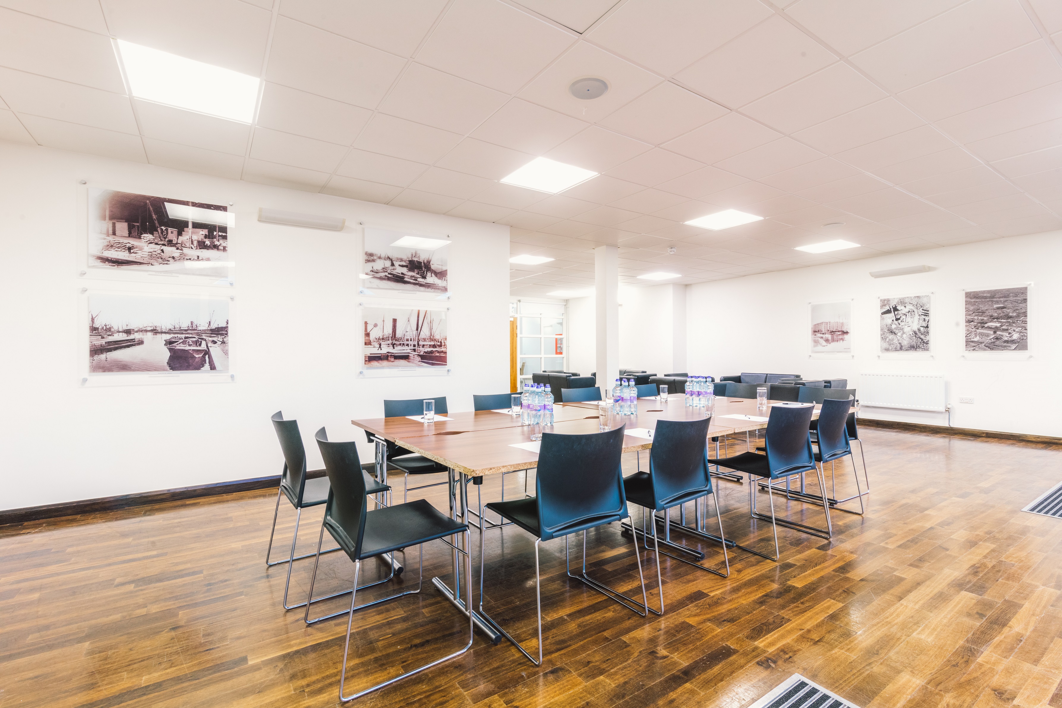 Surrey Docks club room with central table, ideal for workshops and team meetings.