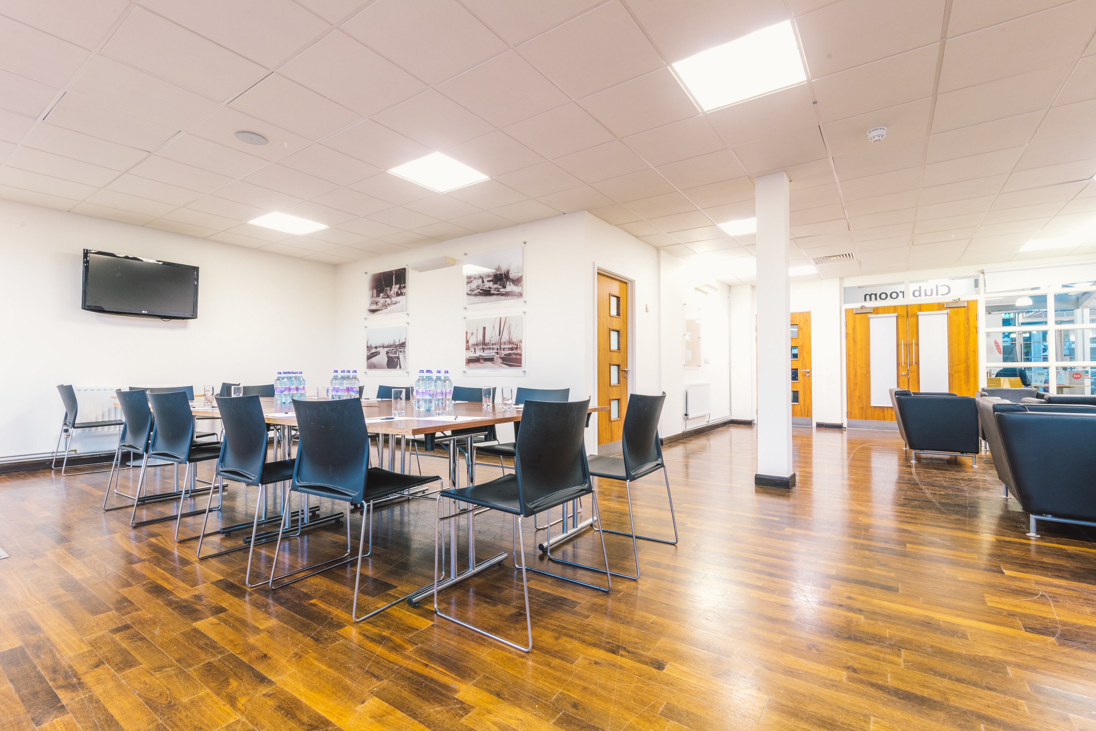 Surrey Docks club room with modern decor, ideal for workshops and meetings.