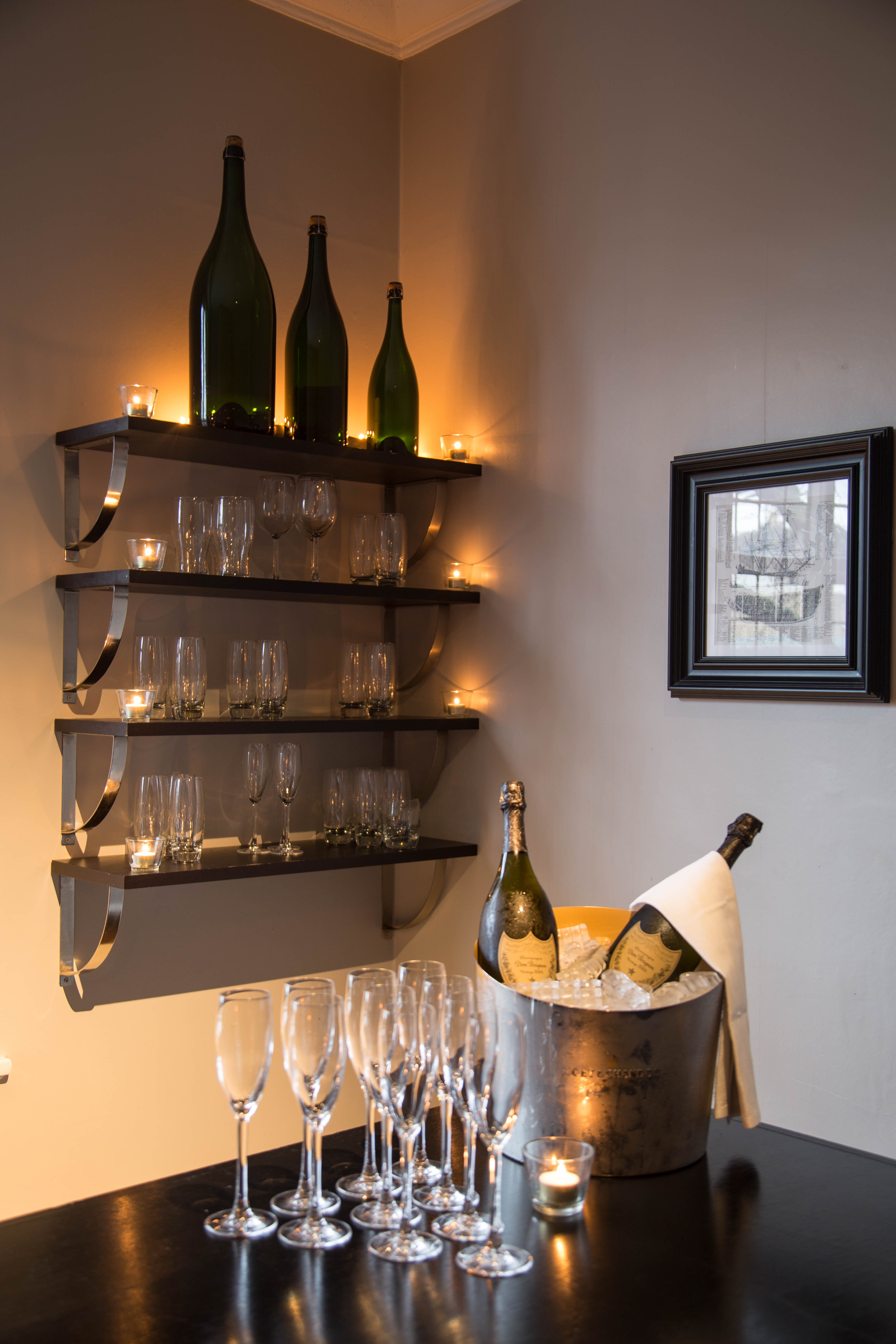 Elegant glassware display in The Navarino Room for receptions and celebrations.