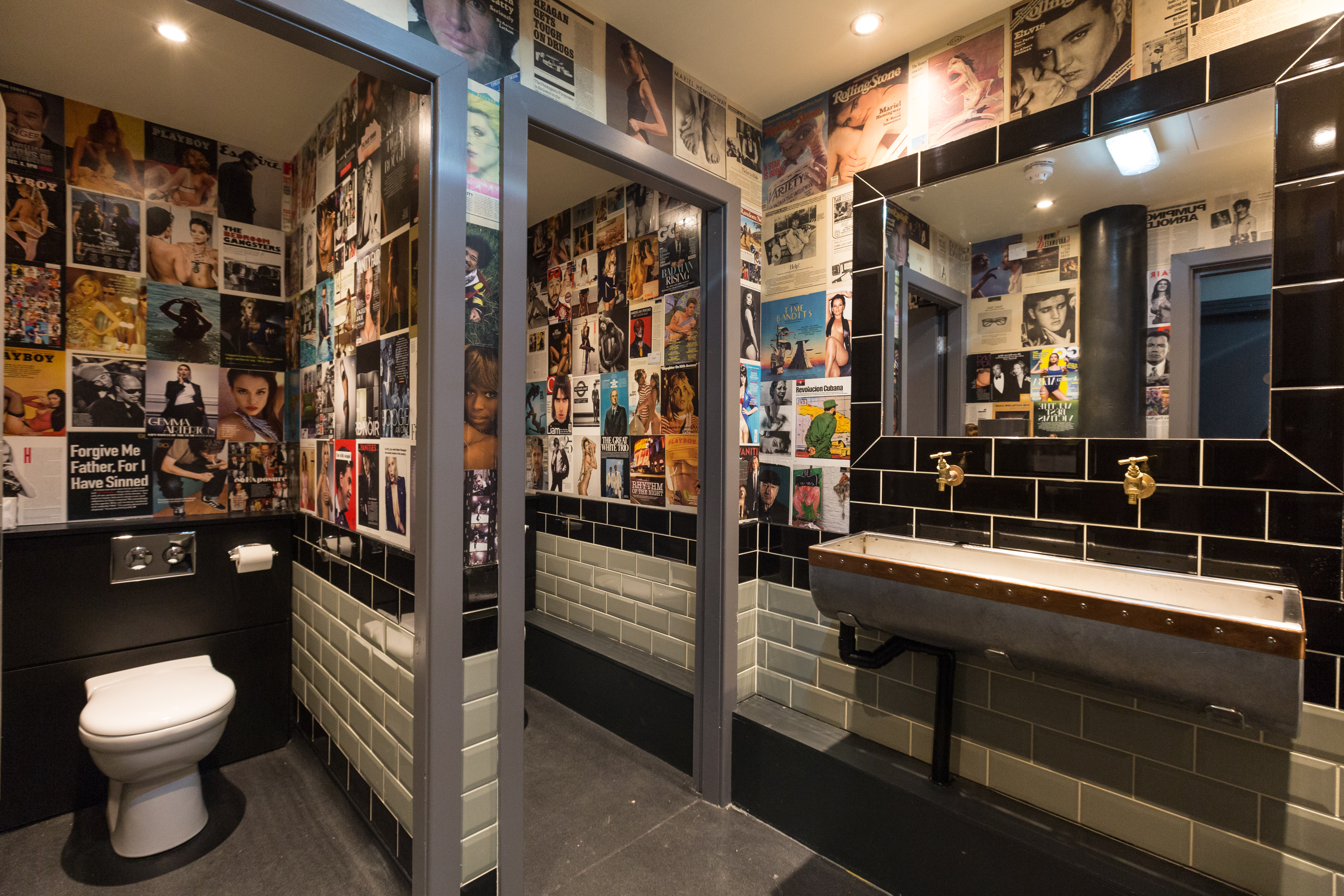 Eclectic restroom art in The Pen and Pencil venue for memorable events.