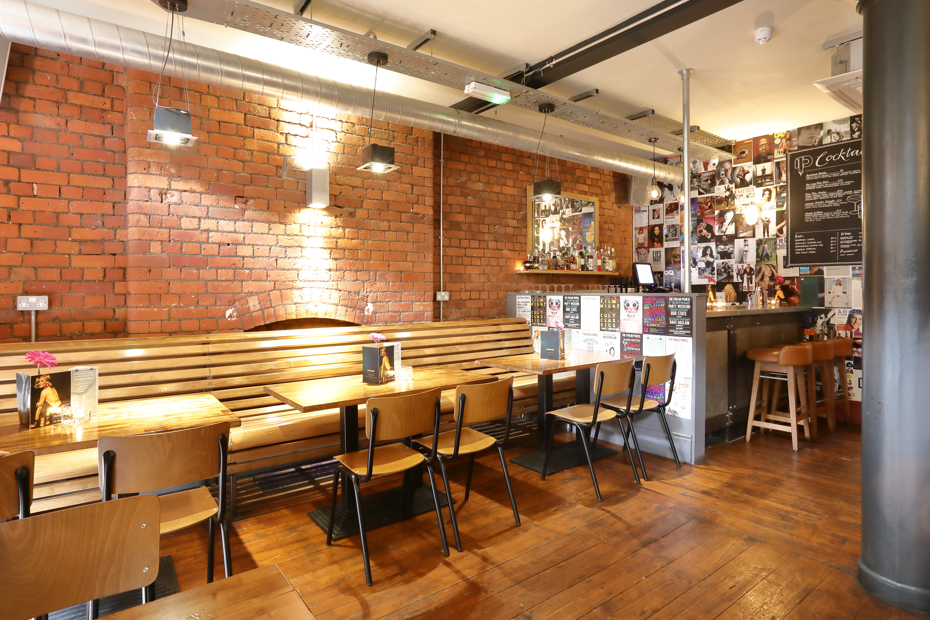 Cozy modern venue with exposed brick, ideal for networking and casual events.