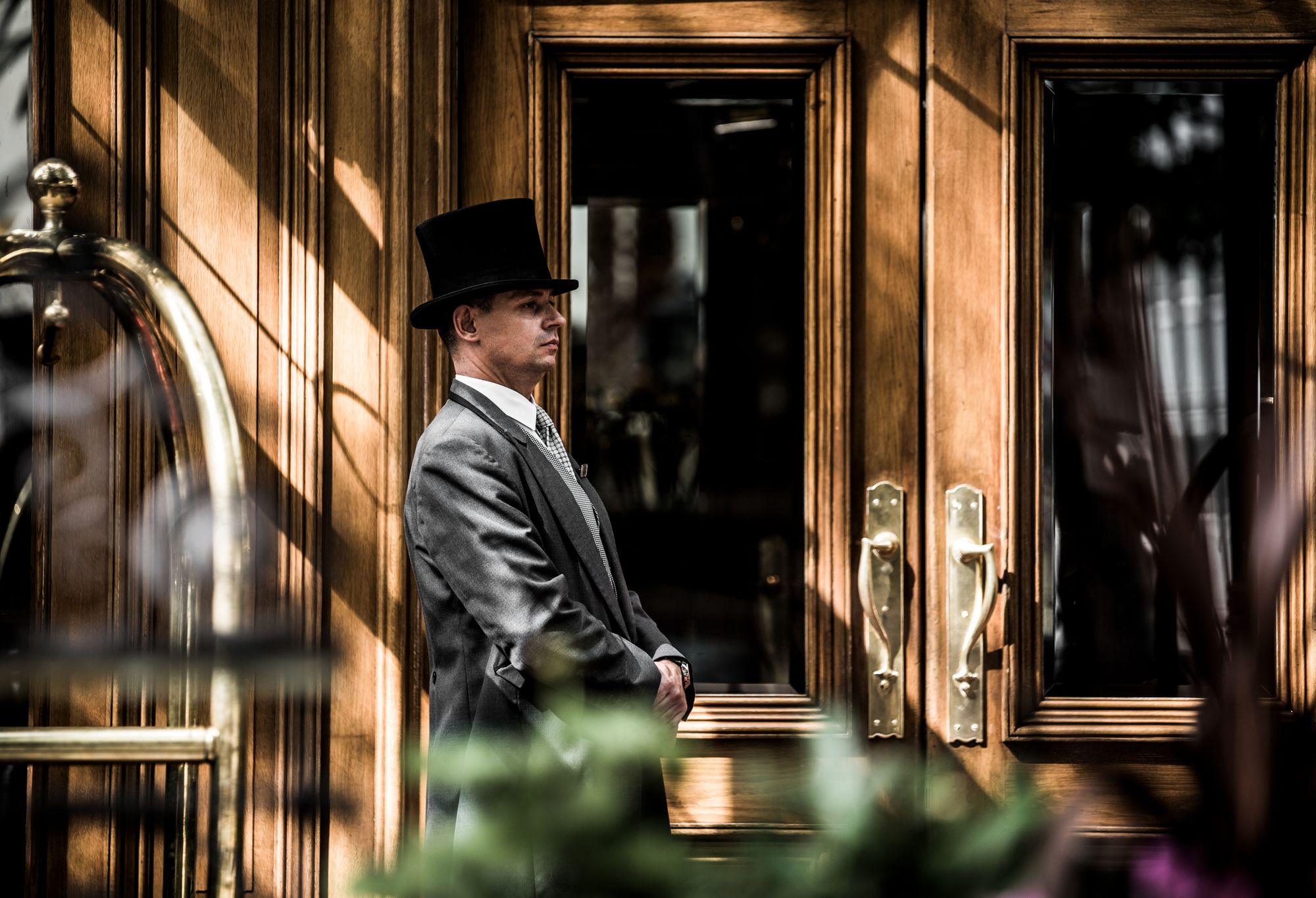 Doorman in formal attire at The Landmark London Grand Ballroom entrance for upscale events.
