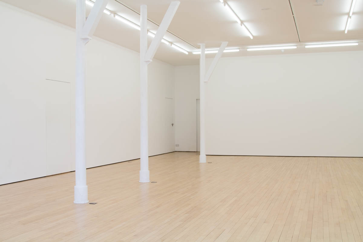 Spacious minimalist event venue in Staffordshire with natural light for corporate meetings.