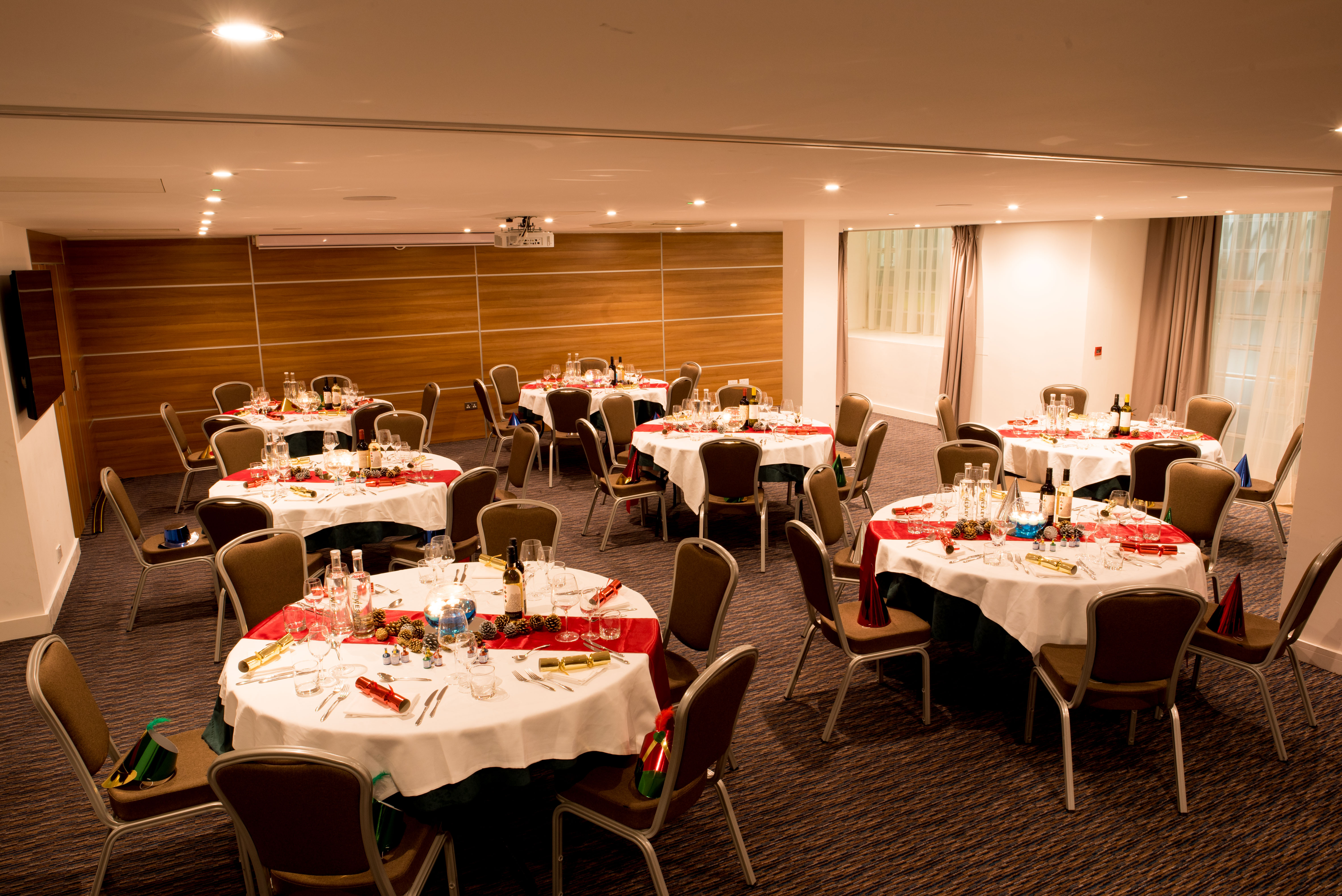 Euston Suite banquet setup with round tables, ideal for corporate events and celebrations.