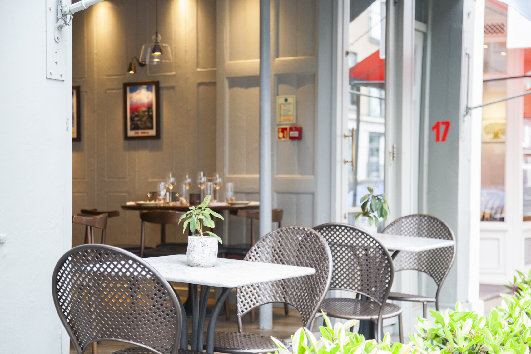 Charming outdoor dining area at Trishna for intimate gatherings and casual meetings.