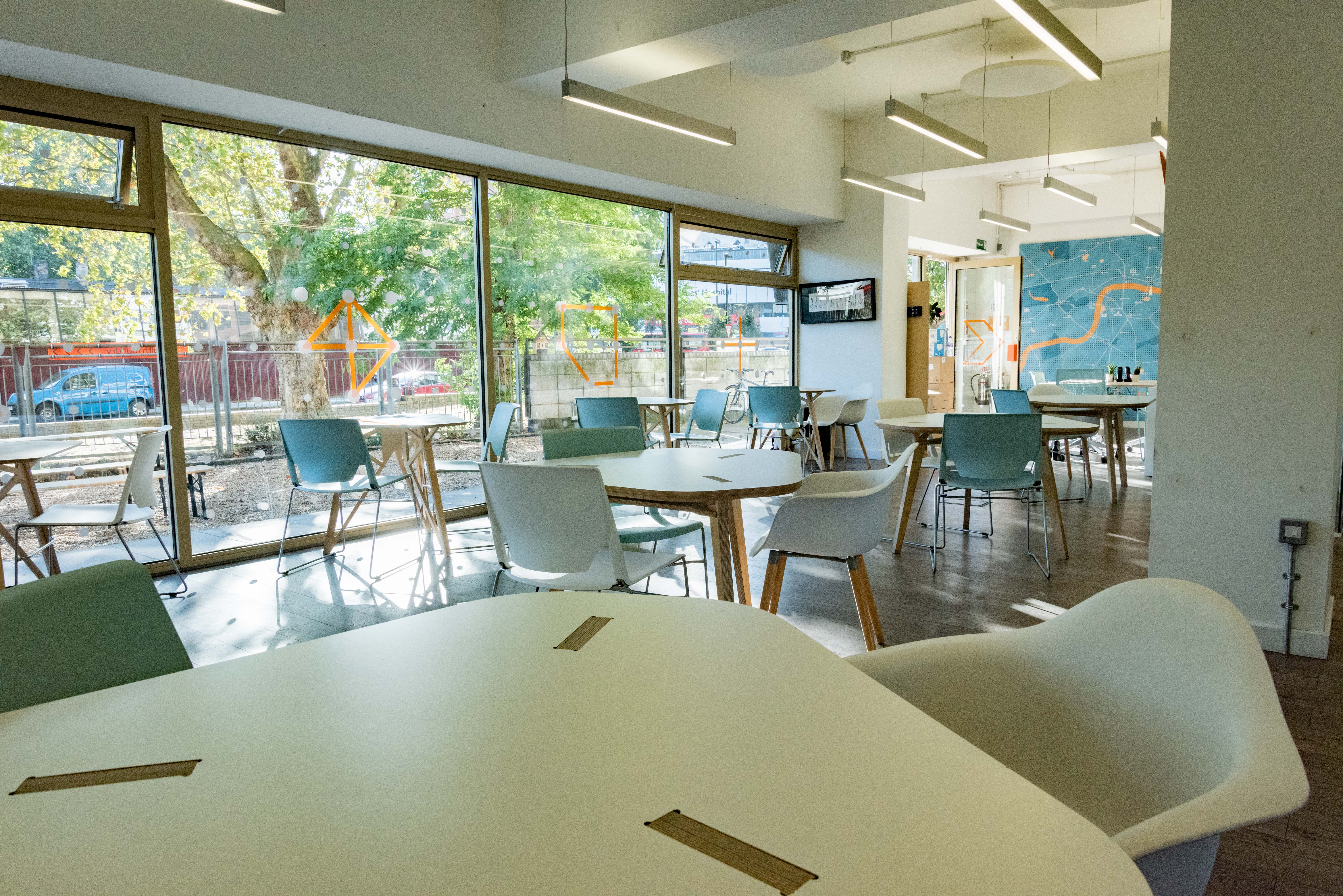 Modern meeting space with large windows, perfect for events and gatherings.