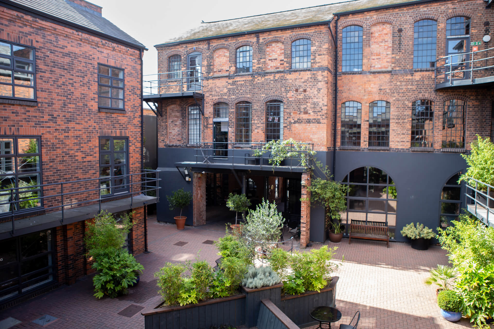 Fazeley Studios courtyard with greenery, perfect for networking events and gatherings.