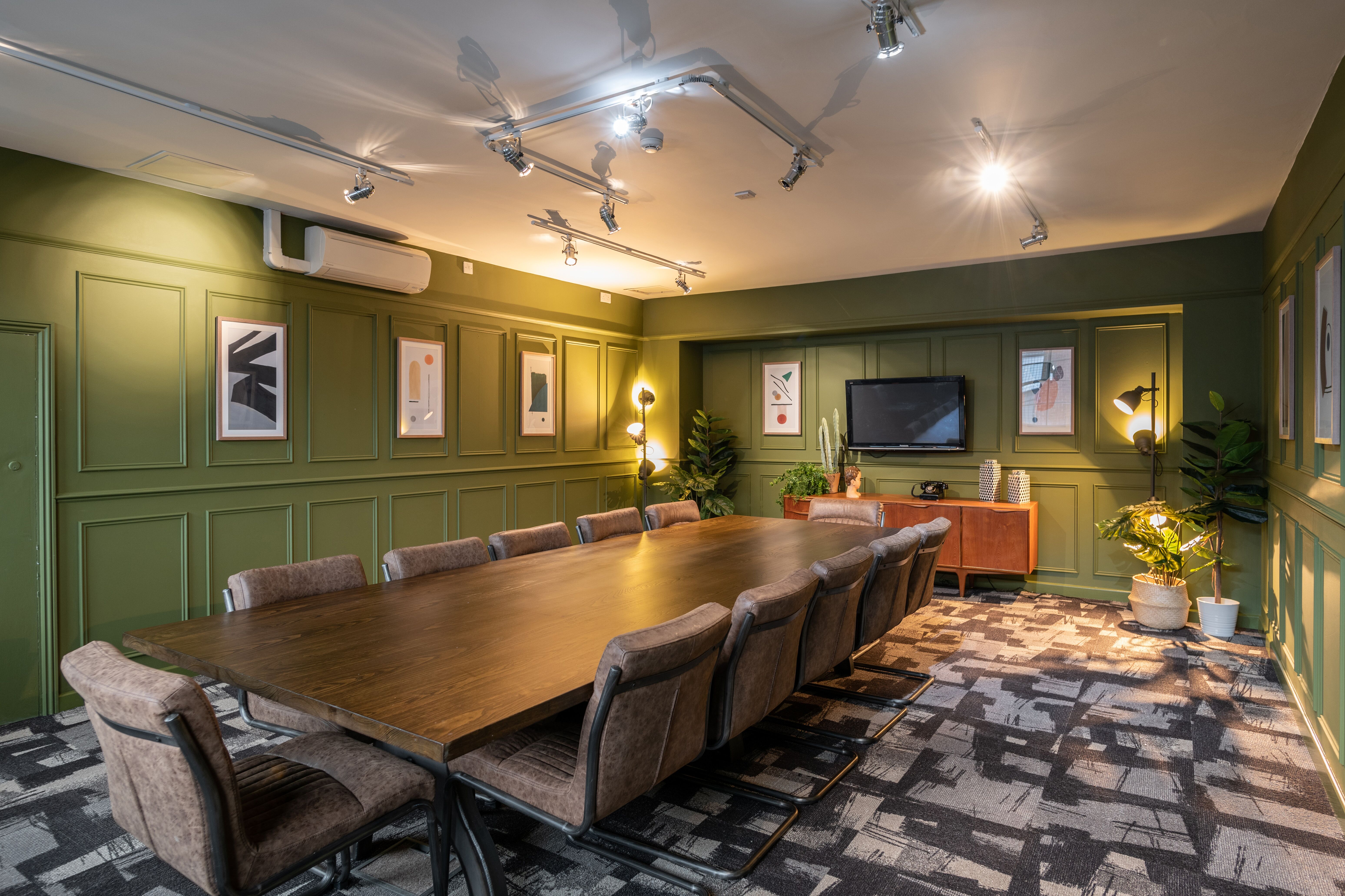 Modern meeting room with wooden table, ideal for collaborative events at Fazeley Studios.