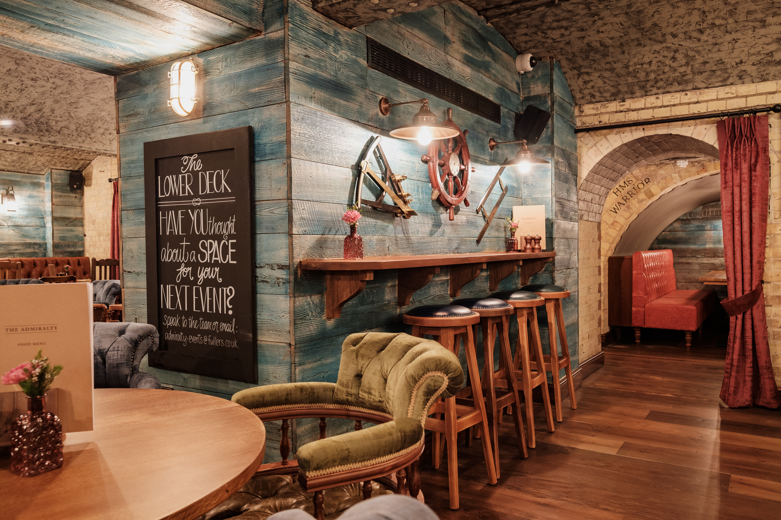 Cozy nautical venue with rustic decor for intimate gatherings and casual meetings.