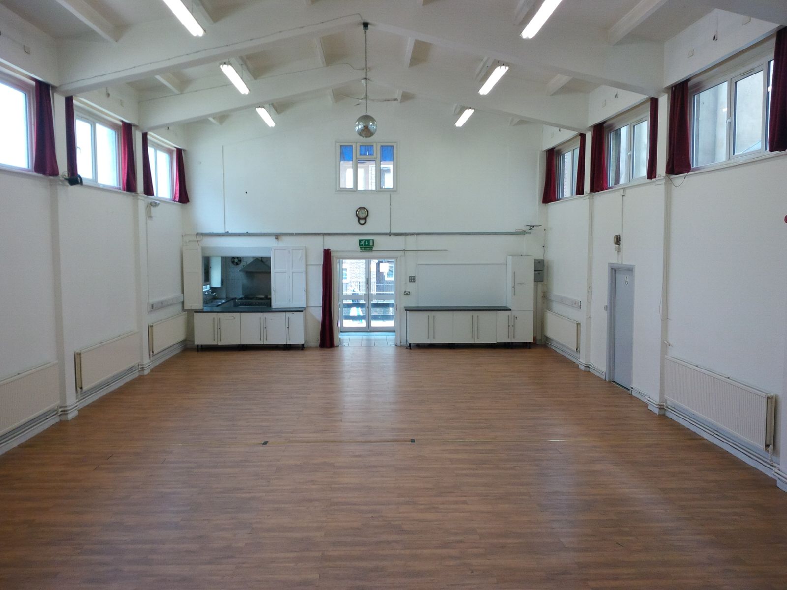 Spacious Main Hall at Centre 151 with wooden flooring, perfect for meetings and events.
