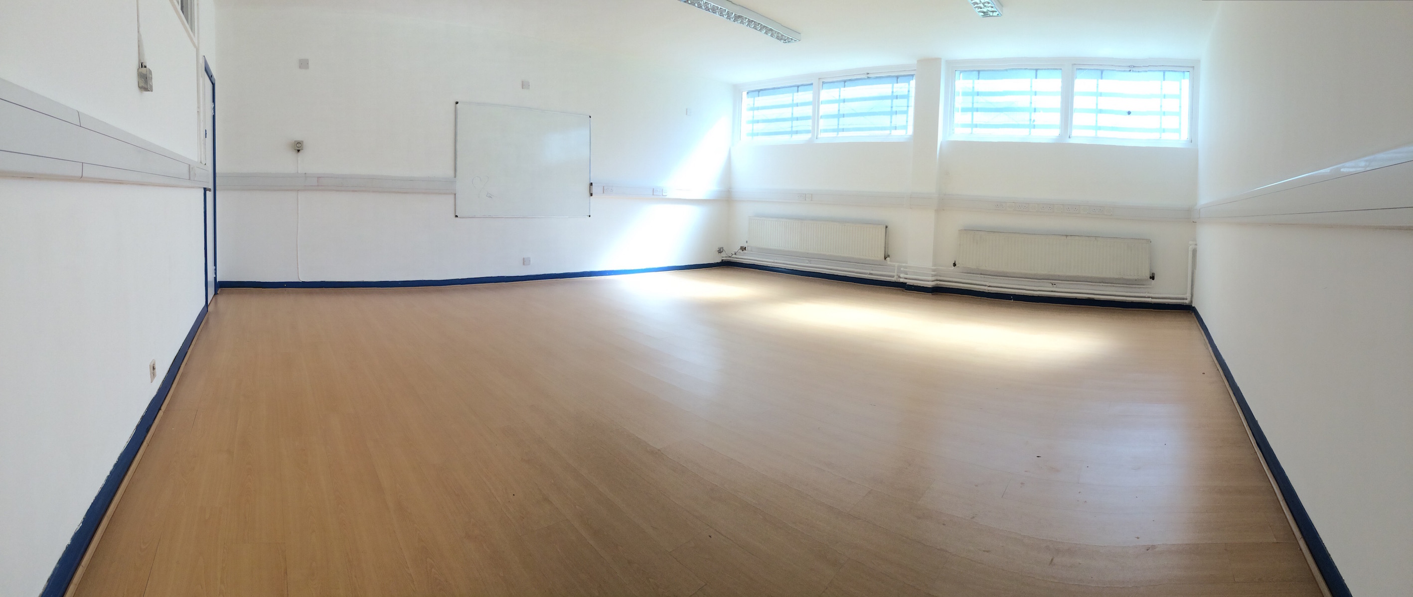 Spacious, well-lit meeting room in Centre 151, ideal for workshops and training sessions.