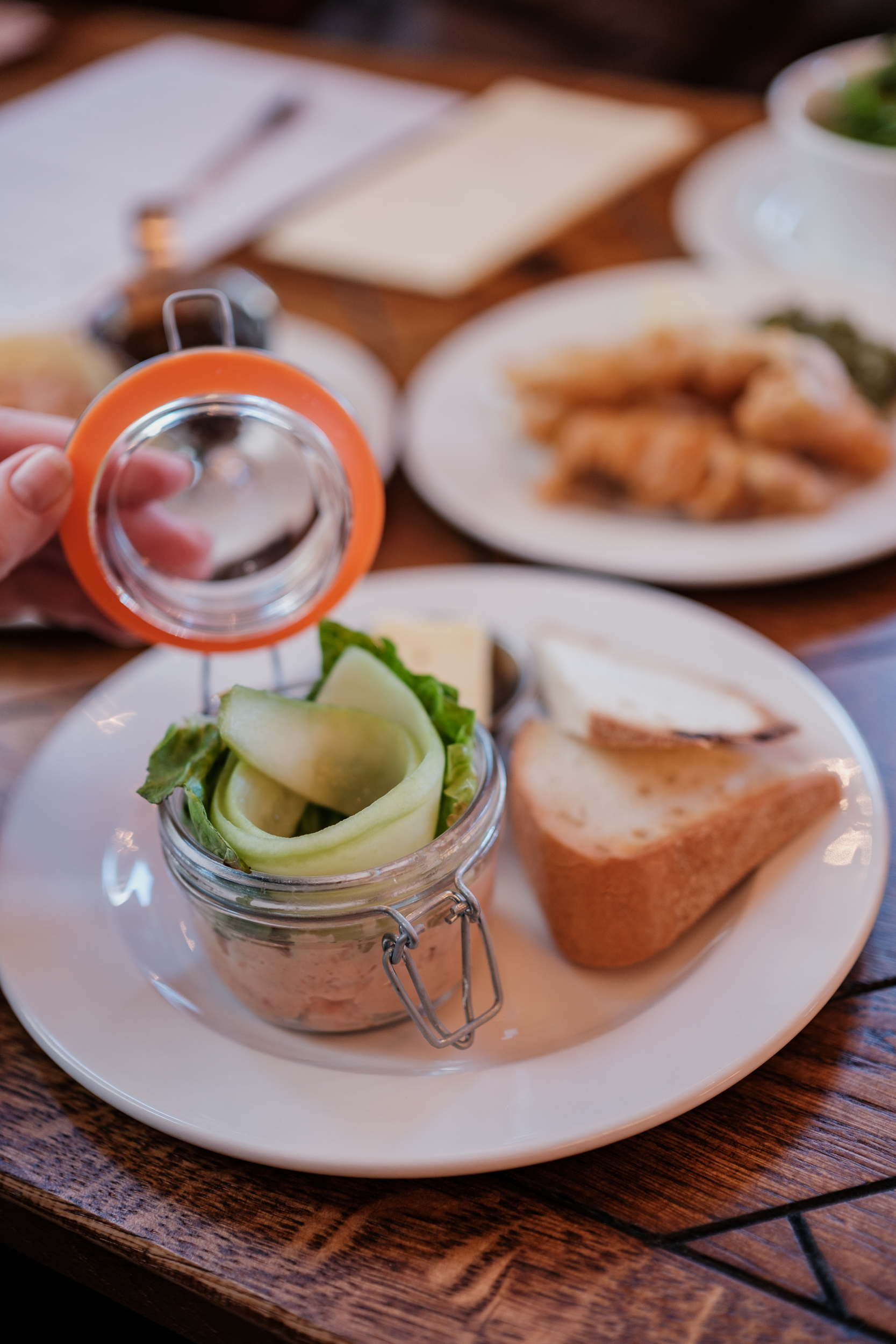 Thoughtfully presented meal with fresh greens, bread, and cheese at The Quarter Deck event.