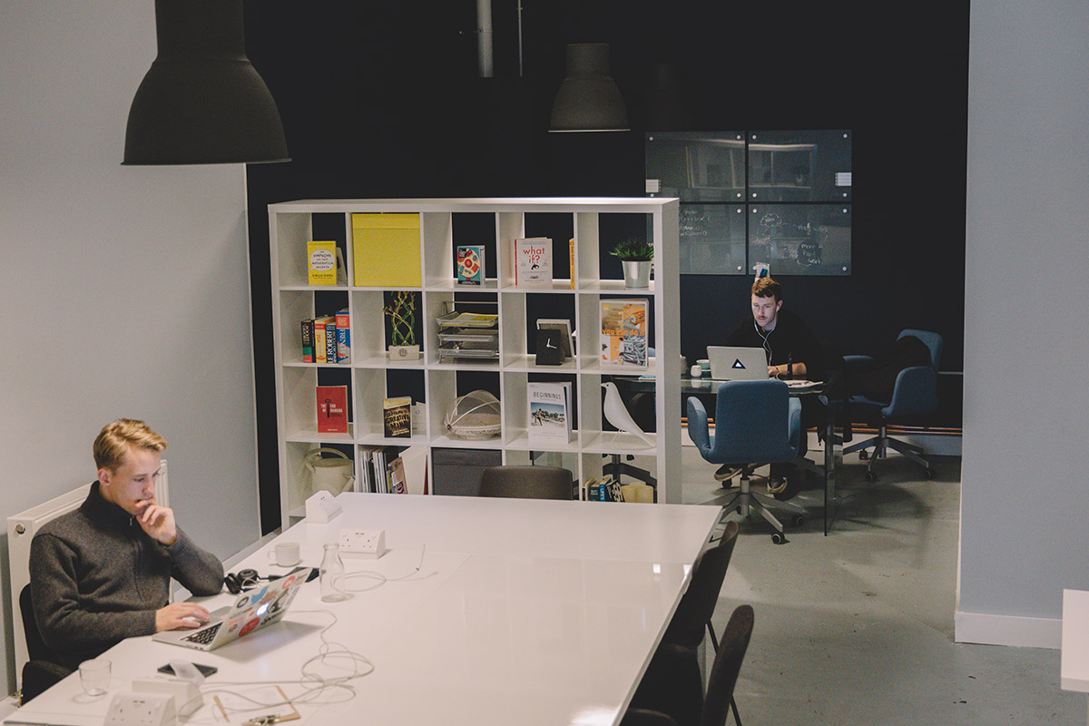 Modern workspace with large table for collaborative meetings and brainstorming sessions.