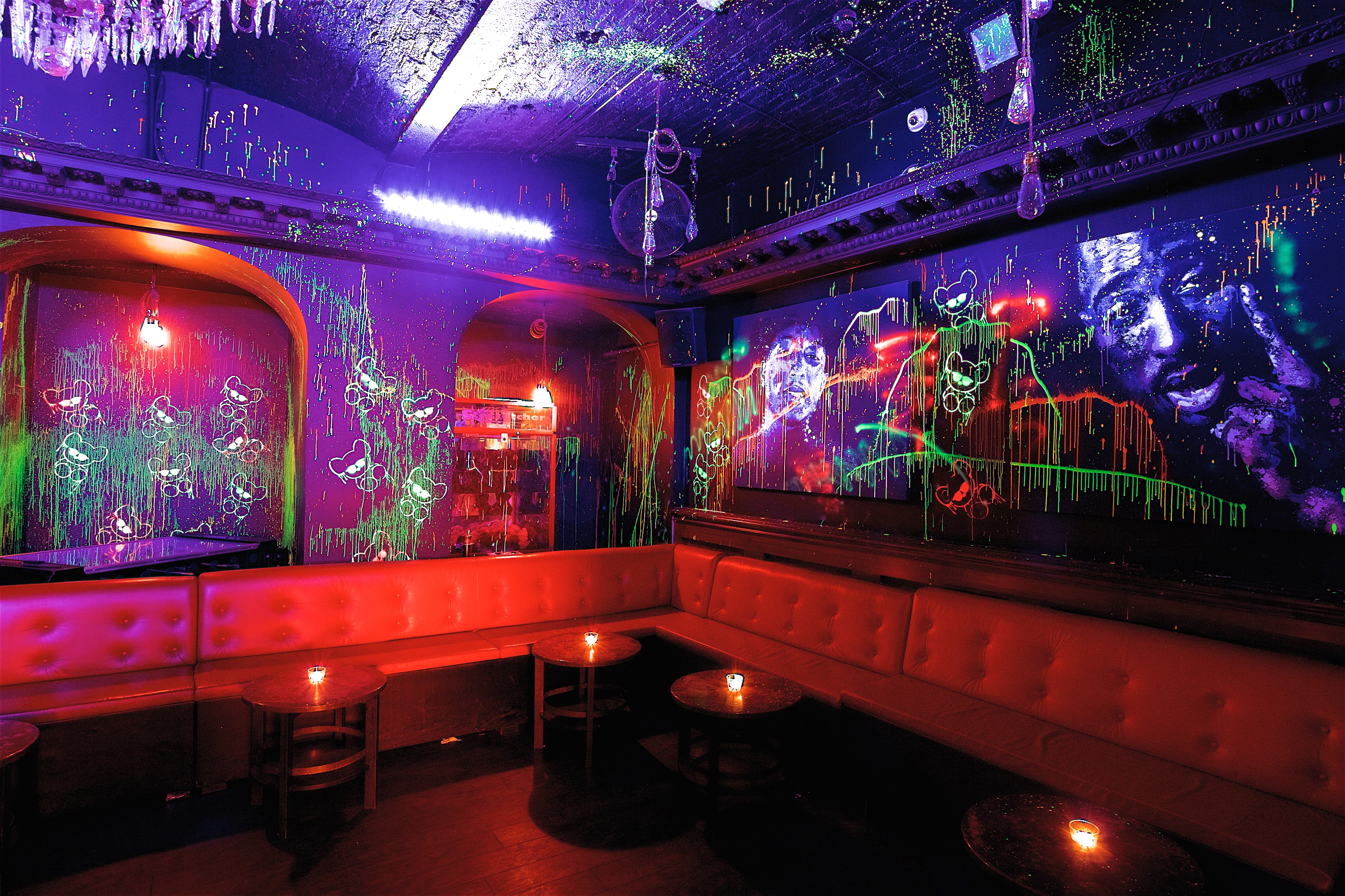 Vibrant neon-lit toy room venue for creative gatherings and themed parties.