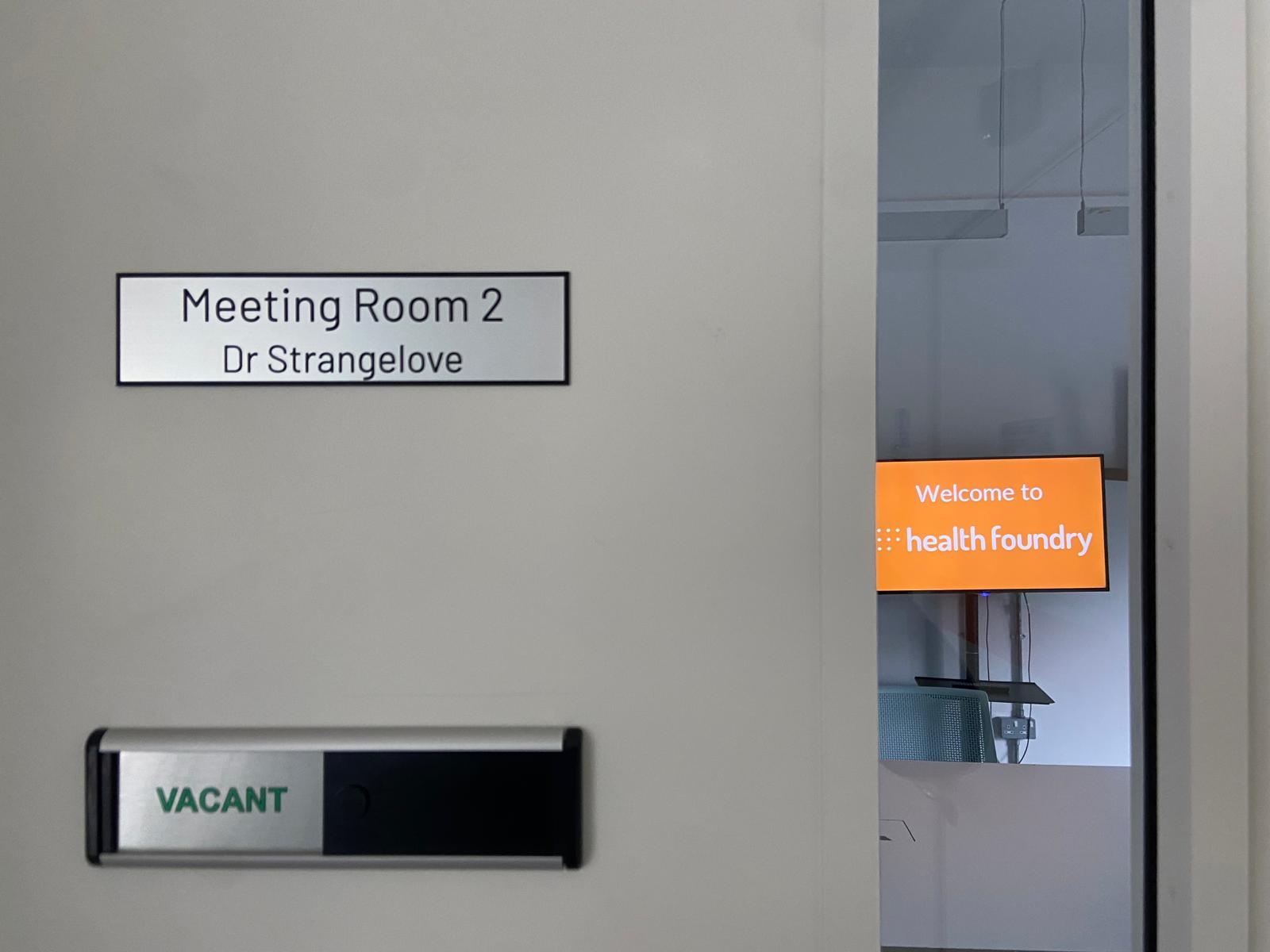 Medium Meeting Room 2 door in Health Foundry, vacant sign for health meetings and events.