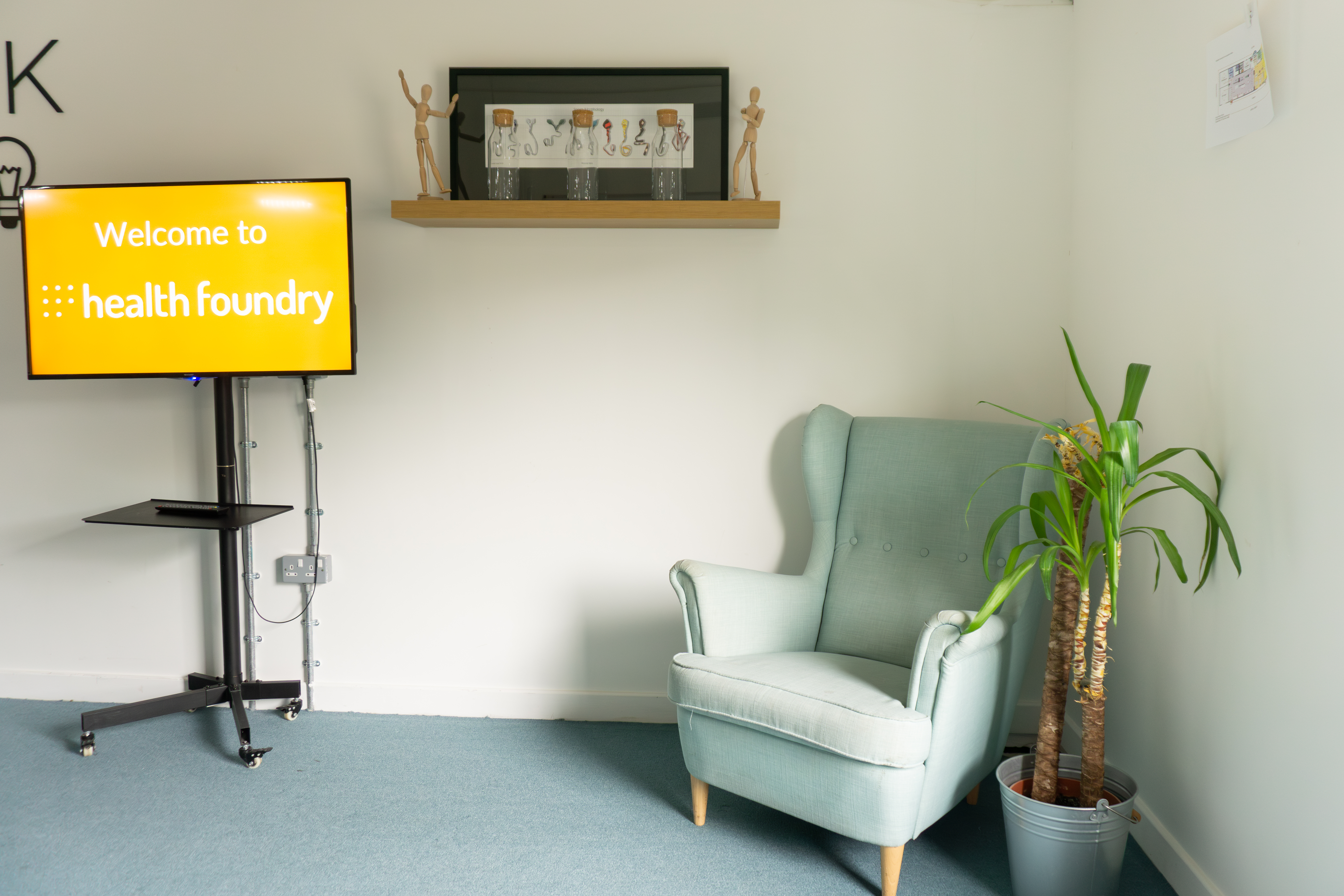 Medium Meeting Room at Health Foundry with cozy armchair for creative brainstorming events.